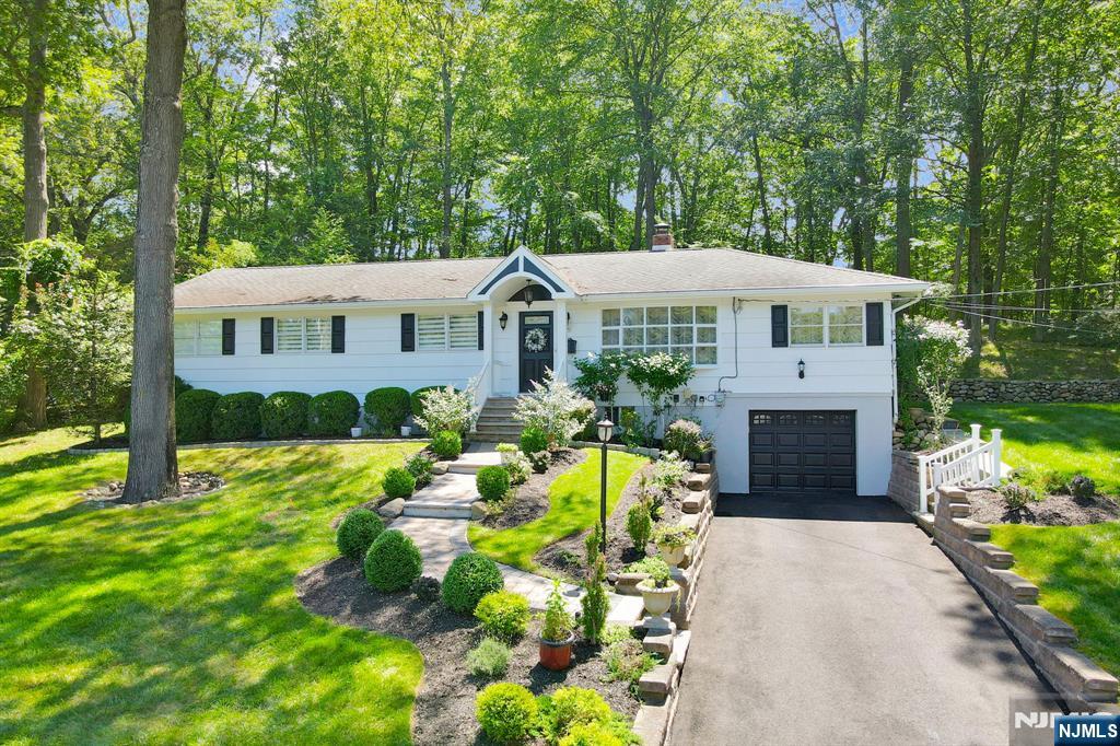 A true gem expanded ranch in Oakland's Dogwood section that offers style, comfort, and thoughtful updates! Impeccably maintained 3BR/2FBA home features hdwd flrs,open concept LR and formal din area, and a striking L-shaped fireplace that adds warmth and character. A well appointed EIK has ss appls and granite counters. Serene primary suite is a private retreat w/vaulted ceiling, skylights, French doors leading to a secluded deck,beautifully updated spa like bath with jetted tub and stall shower, and an impressive walk in closet. Two additional BRs complete main level. Fully fin lower level expands liv space w/generous fam rm, guest BR, FBA, OFC, lndry area, and ample storage, along w/direct access to the one car att gar. Set on a picturesque half-acre of professionally landscaped grounds, this property offers exceptional privacy w/mature plantings,sprinkler sys, and expansive decking. Ideally located near Oaklandâ€™s top rated schools, parks, and recreational amenities, w/ convenient access to NYC transp and major hwys, this home is a rare opportunity to enjoy both tranquility and convenience.