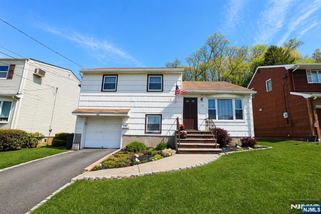 Spacious Split-Level home offering a bright living room, formal dining room with sliding doors leading to a deck, and a well-appointed kitchen. The home also features a comfortable family room, three bedrooms, and 1.5 bathrooms. A walk-up attic provides flexible space ideal for a home office or additional storage, while the partially finished basement adds even more versatility. Recent upgrades include a newer furnace, central air conditioning, and hot water heater. Complete with a one-car garage, this home is conveniently located near parks, major highways, and transportation to NYC.
