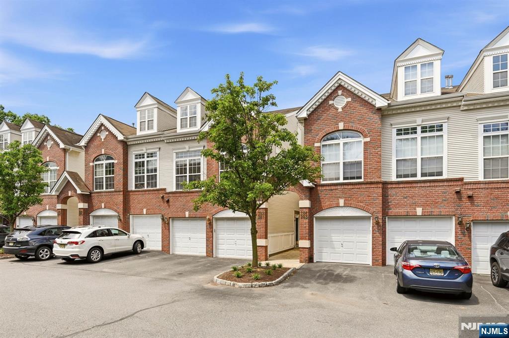 Welcome to the largest & most desirable Berkley model in the community! This stunning sun-filled tri-level townhome has been completely renovated from top to bottom and offers the most spacious floor plan in the complex. Rebuilt in 2007, this exceptional residence features an expanded kitchen and significantly larger loft space than other units. Step inside to discover a gorgeous brand-new custom kitchen, newer ss appliances, beautiful wood flooring throughout, just painted, custom trim work, and completely renovated bathrooms. The luxurious primary suite offers a spacious bedroom retreat, private balcony, large custom walk-in closet, and a breathtaking spa-inspired bath featuring dual vanities, a soaking tub, an oversized custom shower, stunning tile work. The beautifully updated guest bath and stylish powder room complete the home's impressive upgrades. The open and airy layout offers soaring ceilings, oversized windows, and abundant natural light. The spacious living room is perfect for entertaining, while the massive loft provides endless flexibility as a potential 3rd bedroom, office or media room. The upper level also includes a laundry area, linen closet, and guest bedroom. Residents enjoy access to a clubhouse, pool, and tennis courts. Ideally located steps from NYC transportation, Target, restaurants. Only 9 miles from New York City, making this a true commuter's dream. A rare opportunity to own one of the finest and most extensively updated homes in the community.