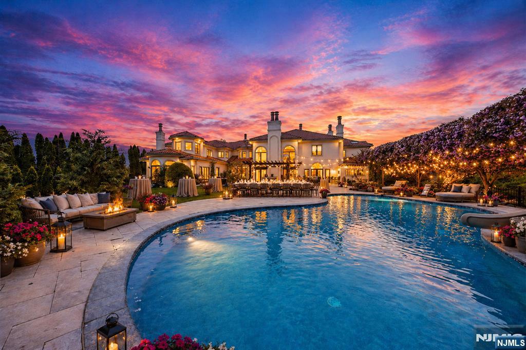 https://newjerseyproper.com/142-hoover-dr-cresskill-nj/ For more info. Experience uncompromising luxury in this private, custom-built palatial mansion offering unobstructed mountain & sunset views. No expense was spared in the original construction or the extensive renovation, featuring a steel-frame structure, imported marble, exotic hardwoods & refined architectural details throughout. The residence offers nearly 12,000 square feet of living space, complemented by an additional 6,000 sq ft lower level w/caretaker quarters, game room, spa & a newly completed theater and professional recording studio. Set on 1.5 private acres, the home includes 7 bedrooms, 9 1/2 bathrooms, 6 fireplaces, and 6 private balconiesâ€”ideal for everyday living & grand-scale entertaining. The remodeled backyard oasis showcases a smart pool, brand-new 7 person jacuzzi, expansive 3,000-square-foot white marble patio, pergola, basketball court & dedicated BBQ area, creating a true resort-style retreat. Additional highlights include high-tech surveillance and security systems, a heated four-car garage with space for lifts, elevator, central vacuum, and advanced home systems throughout. The home may be offered furnished, allowing for immediate move-in. Perfectly positioned just eight miles from Manhattan and approximately 30 minutes from Newark Liberty International Airport, this extraordinary estate delivers privacy, prestige, and convenience at the highest level. Owner has Real Estate License.