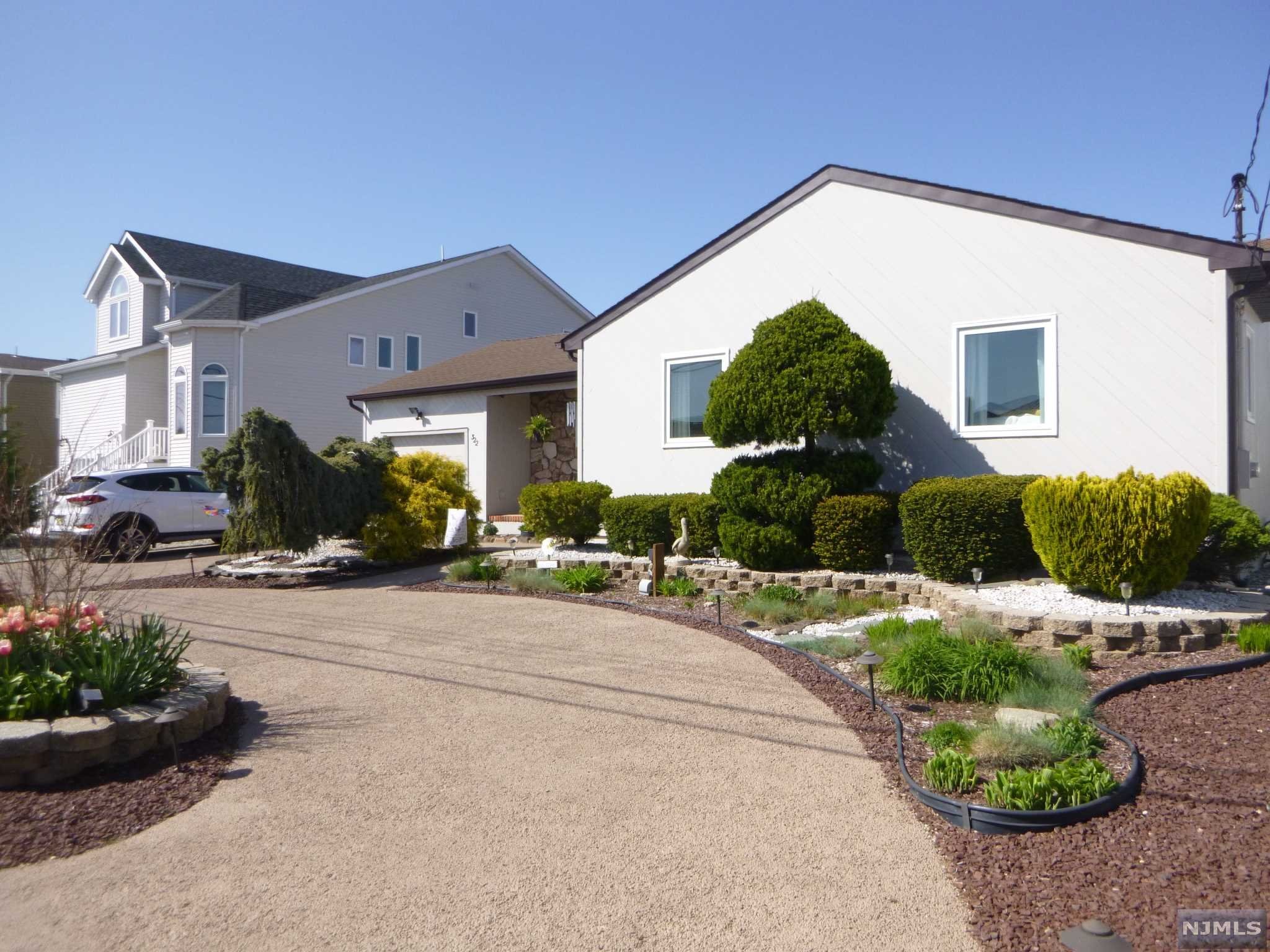 Shore to Please! Welcome to Waterfront Living at the Jersey Shore! Located on lagoon direct out to Silver Bay/Barnegat. This Well maintained home is turnkey and ready for Summer Fun! Newer Bulkhead,Dock, Scenic Family Room All New windows, Doors, Floors, Gas Fitted Fireplace, EIN Kitchen, Dining Room, Laundry Room, Garage w/ Storage. Perfect for Entertaining Waterviews with Oversized Rear Deck. Best & Final by 6/21/22 5PM