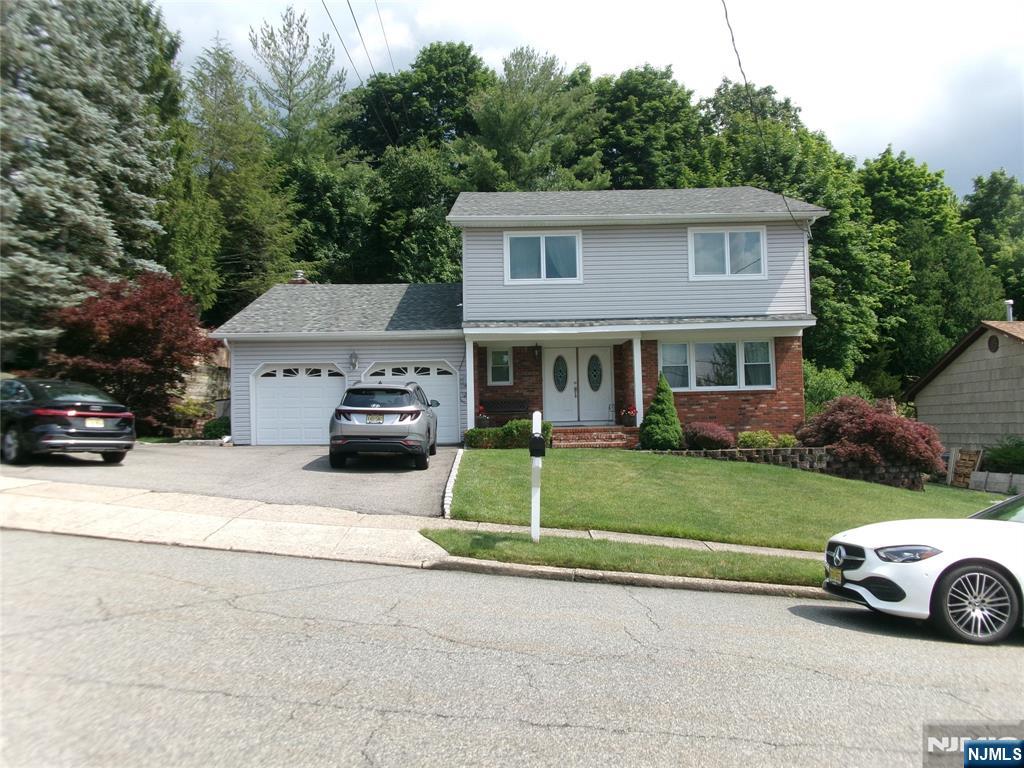 This is a well maintained 4 Br, 2.5 bath Colonial. Renovations can be seen through out the home , in the kitchen with the Cherry Cabinets and granite counter tops, the baths, also with granite top vanities, the siding, windows, 3-year-old roof , A/C and Water heater. Hardwood floors can be seen through the home Exit out the cozy Family rm , w/ frpl onto the custom stoned patio, which is also seen in the walkways. The stoned wall surrounding the level rear yard also offers privacy.