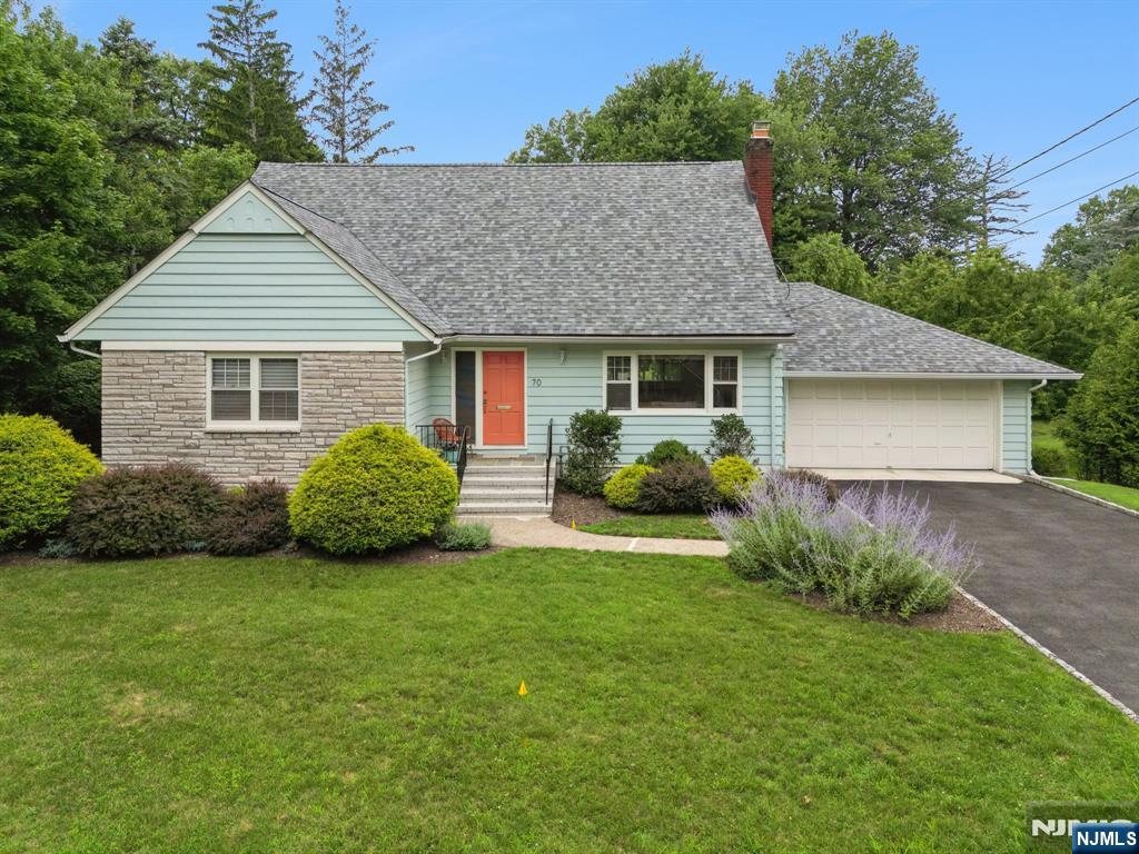 Just minutes from the NYC train & the charming hubs of Upper Montclair & Little Falls, this turnkey home sits on one of Little Falls' most coveted streets. Sunlight pours through picture windows highlighting the spacious living room w/ frplc, formal seating area, & separate lounge space, perfect for relaxing or watching TV. The newly renovated kitchen shines w/ Bosch appliances, custom cabinetry, & farm sink. Flowing seamlessly into the dining room, w/ sweeping views of the expansive property, this inviting space is ideal for formal meals or a cup of coffee & your laptop. A secluded, breezy sunroom is an idyllic retreat for reading or an afternoon nap. First-floor laundry w/ half bath offers backyard access, while a flexible bedroom with adjacent full bath is ideal for guests, home office, or one-floor living. Upstairs, you'll find a large second bedroom with two deep closets, a gracious primary w/ walk-in closet & sitting area, plus a second full bath and attic storage. The lower level, with full size windows and access to the 2-car garage, features a TV area, billiards/ping-pong zone, home gym & bar! Add'l highlights incl a new roof, newly paved drive, freshly painted exterior, hrdwd flrs, & car charger. Featured by The NYT as a low-key historic suburb, Little Falls offers a vibrant Main Street w/ shops, restaurants, cafes & fitness studios, plus parks, nature trails, highly rated schools & lower taxes than many neighboring towns. This lovely peaceful home is a must see!