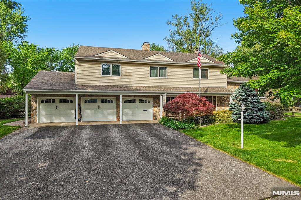 Welcome to 123 Midwood Road! A rare opportunity tucked away on a quiet cul-de-sac in one of Paramusâ€™s most sought-after neighborhoods. Perfectly positioned at the end of the street near a beautiful local park, this exceptional property offers the ideal blend of privacy, space, and endless potential. Set on an expansive and ultra-private 23,588 sq ft lot, this impressive home features 4 spacious bedrooms and 2 Full Baths & 2 Half Baths, designed for both comfortable everyday living and effortless entertaining. The possibilities here are truly endless. Step outside into your own private resort-style backyard oasis featuring a stunning 18x36 inground pool, an incredible pavilion area perfect for outdoor gatherings, and a spacious deck overlooking the beautifully landscaped grounds. Whether hosting summer parties or enjoying peaceful evenings at home, this property delivers an unmatched lifestyle experience. Car enthusiasts, hobbyists, or anyone needing exceptional storage will love the massive 3-car garage setup. A highly desirable feature in this premier location. Surrounded by luxury homes on one of the most desirable streets in town, 123 Midwood Road offers an extraordinary opportunity to move right in, expand, renovate, or create your dream estate. A truly special property in an unbeatable location
