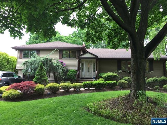 A beautiful spacious house in desirable Glen Rock. This home has it all: from best location near park, NYC transportation, Shopping and school to a large deck with retractable awning overlooking private back yard. The house features modern eat in kitchen with granite countertop and s/s appliances. Dining room, LR Great Room with fireplace and sliding glass doors to the large deck complete the first floor. 2nd level has a master bedroom with half bath, 2 bedrooms and a full bath. Ground level has a den, full bath and laundry room. Basement is finished. Landscaping and lawn maintenance included in the rent.