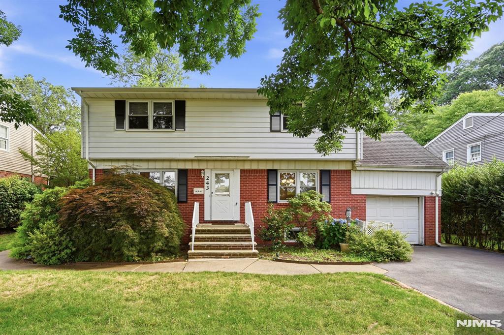 Located in quiet residential neighborhood close to schools and just blocks away from NY transportation, this updated 5 bedroom, 2.5 bath home is a must see! Broght & open living room and dining room with hardwood floors, newly renovated granite and stainless kitchen with eating area, 5th bedroom/ office and updated bath offer spacious first floor living. Upstairs you will find a king-size primary bedroom, three additional bedrooms plus updated bathroom. There is a rec room with 1/2 bath and laundry and a one-car garage. Set on oversized 141' deep fenced private property with patio area and oversized shed.