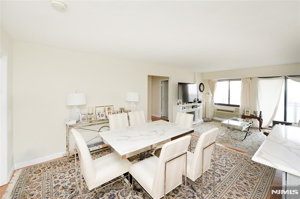 Welcome to The Sherbrooke, a highly regarded full-service co-op located on prestigious Prospect Avenue in Hackensack. This bright corner 2-bedroom, 2-bath residence on the 10th floor offers stunning dual exposures with sweeping NYC skyline views and beautiful sunset vistas. Enjoy indoor-outdoor living with your own private terrace, perfect for morning coffee or evening relaxation above the treetops. The home features an open-concept layout with a redesigned kitchen that flows seamlessly into the living and dining areas, highlighted by a large center island with a premium stone countertop, ideal for both everyday living and entertaining. Additional highlights include spacious room sizes, abundant natural light, and thoughtful updates throughout. The home has been freshly refined with smooth ceilings (original popcorn ceilings removed), enhancing the clean, modern feel. The second bedroom features brand new carpeting, and the primary bathroom has been tastefully updated, adding both comfort and style. The Sherbrooke offers a full-service lifestyle with a 24-hour doorman, security, and a beautifully maintained community pool. Monthly maintenance includes property taxes, heat, hot water, and common area maintenance, offering excellent value for a full-service building. Ideally located near shopping, dining, and major transportation options with easy access to NYC, this home combines space, views, and accessibility in one of Bergen Countyâ€™s most desirable locations.