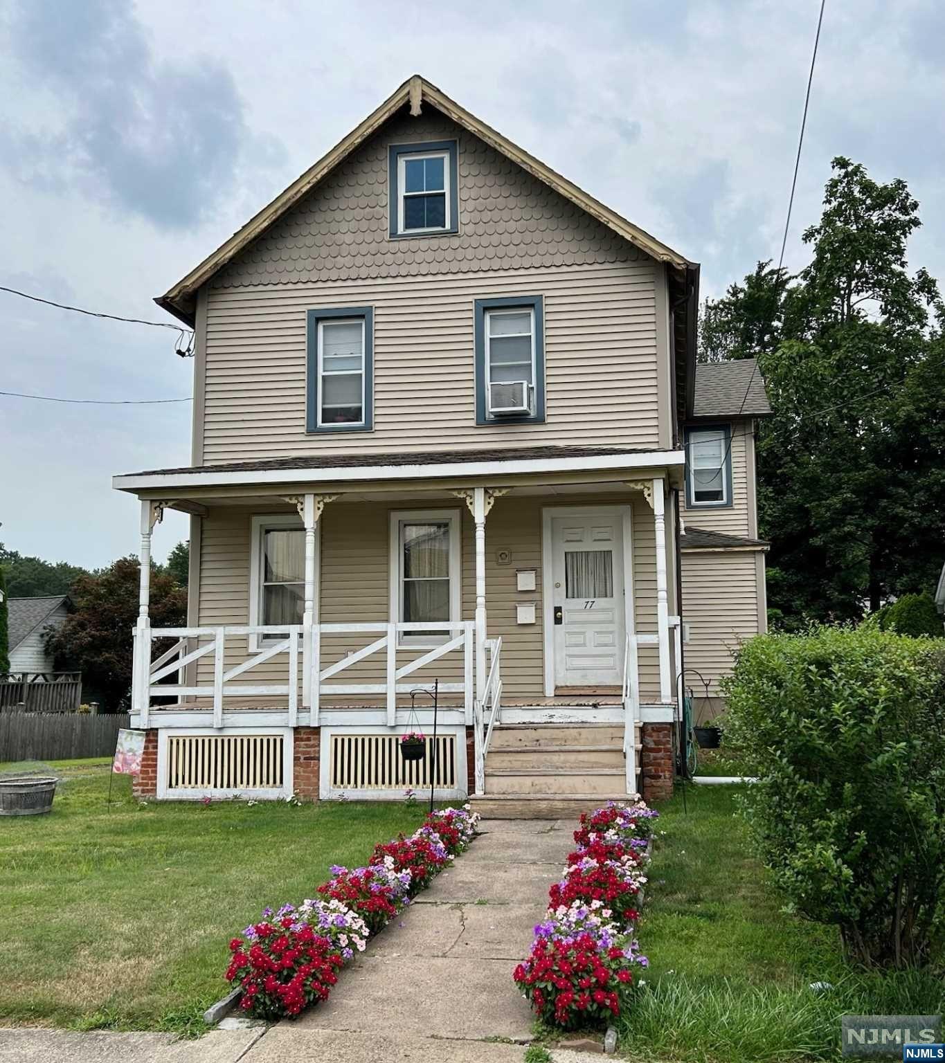 Terrific opportunity to own a two-family home in the center of town with a private backyard! 1BR on each floor with a walk-up attic from the 2nd floor apartment. The 1st floor unit has an updated kitchen & bathroom with access to the basement. Features include hardwood floors, two new tankless water heaters, & separate utilities. Long driveway w/plenty of parking. Very close to shops, restaurants, parks, schools & transportation (less than half a mile to the train station).