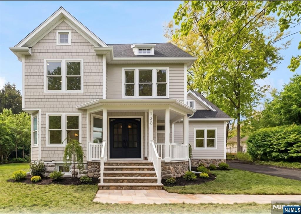 Welcome home! This newly built and renovated residence offers exclusive, turn-key luxury steps from downtown Ridgewood. The pristine main level features an expansive foyer with a formal living room framed by a gorgeous archway leading to a spacious dining room. Come tour the curated chefs kitchen with premium paneled appliances, dual dishwashers, sinks and ovens; including a 48 inch range and walk-in pantry with a speed oven. Enjoy views of the backyard while having your favorite drink from the coffee bar or beverage fridge at the gorgeous 10 ft island with plenty of seating and storage. The adjoining family room offers a stunning leathered fireplace, vaulted ceilings, and a picturesque setting. Ideal for generational living, the first floor includes a bedroom , WIC and workspace with a full bath. Upstairs, the primary suite amenities include dual custom walk-in closets, a tranquil spa bath, w/ 6 ft freestanding tub, alabaster sconces, stone-featured shower and hidden niches. A massive laundry room, three bedrooms and bathroom complete the second level. The third floor is an expansive suite with a full bath, perfect for a teen, playroom, office, or au pair. The finished lower level with 9ft ceilings provides flexible space for a gym, game room, and storage. The deep backyard features a patio with gas hookup, room for a pool, an oversized driveway with a two-car garage and full loft space above. Prime location - only 1 block from restaurants, shopping, and NYC transportation!