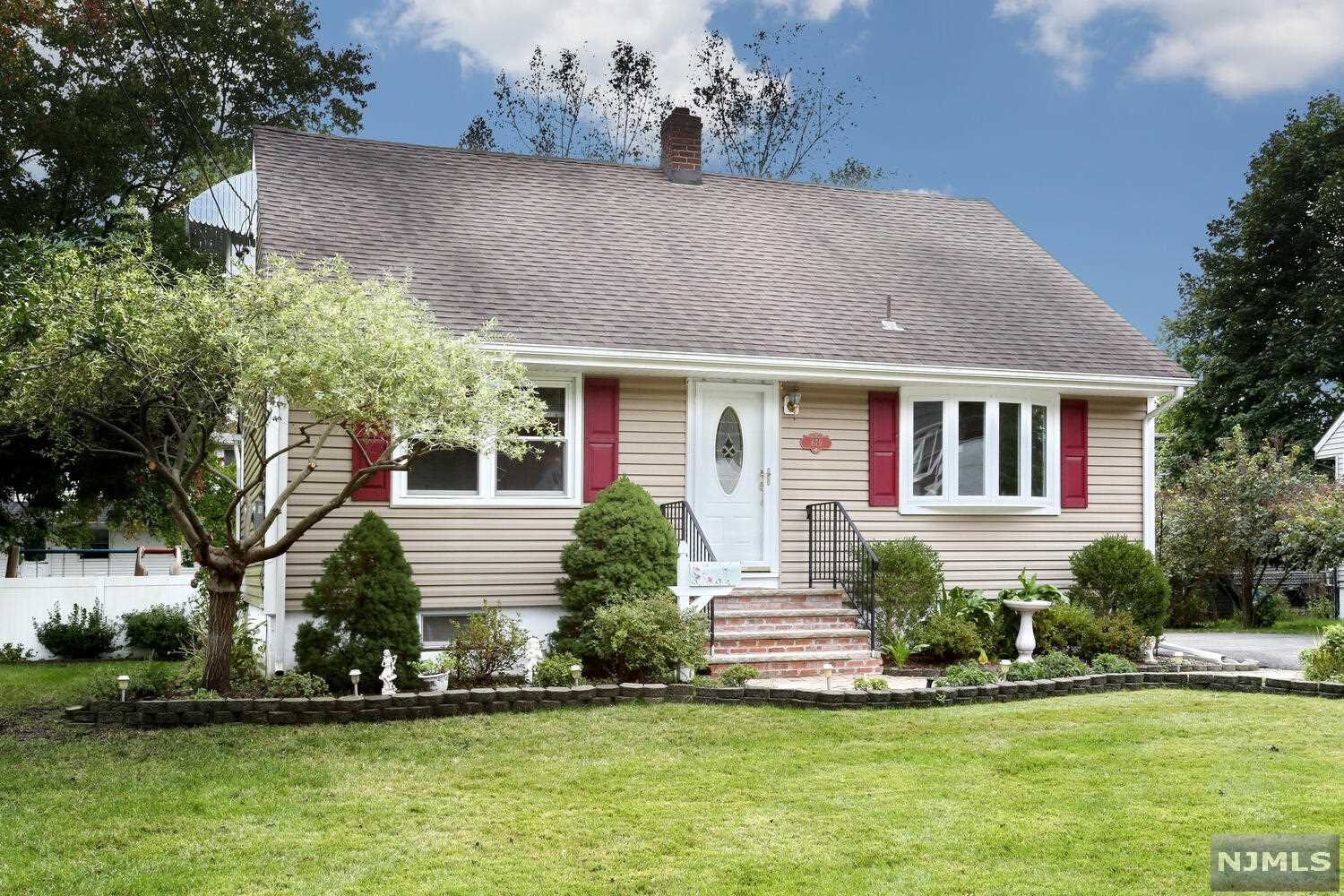 Welcome to this light&bright beautifully updated &lovingly cared for 4BR/2Bath home with expanded rear dormers, 2car garage, patio, wonderful private fenced yard &unfinished basement. Updated kitchen w/Granite Counters, Cherry wood cabinets, SS Appliances,tile backsplash, wood floors &door out to yard. Lovely Dining Room opens to the Kitchen &has wood floors &a new chandelier. LR with lg bay window &wood floors under carpet. First floor also has 2 BRs with HW floors& Updated Full bath w/SOT. Large front to back Dormer Master BR &BR 2 on the second floor share a full updated Bath/SS &have ample closets. Offers 3 Yr High efficiency Furnace with Instant Hot Water &some newer windows. Lovely quiet neighborhood location near top schools, parks& recreation. Trendy Town with movie theater, Restaurants& Shops. A Commuter Delight with easy NY train/bus transportation. Sold as is. Don't miss this treasure with great curb appeal!