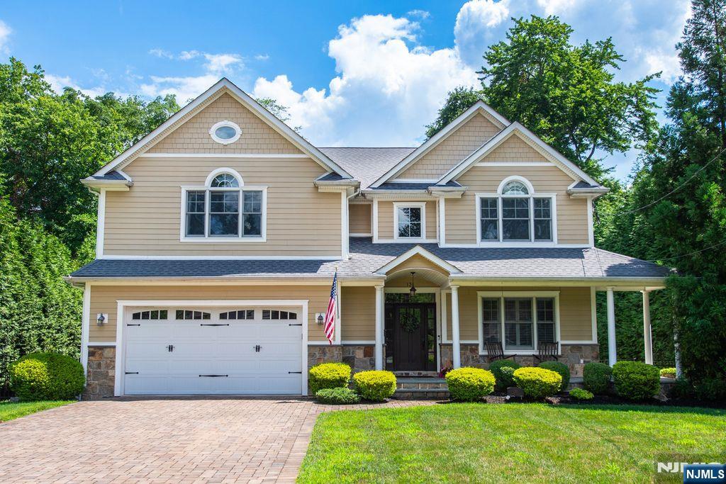Modern elegance meets classic design in this stunning Colonial, located on a sought-after street in Harrington Park.Built in 2012, this 4 bedroom, 4.5 bath home offers 9' ceilings on the main level, gleaming hardwood floors, and an open floor plan designed for everyday living and entertaining. A lovely covered porch and impressive 2-story entry set the stage for what's inside. The gorgeous Eat-in Kitchen with center island, the sun-filled Family Room and the spacious Living and Dining Rooms, create an inviting atmosphere. Enjoy seamless indoor-outdoor living with access to the patio and the beautiful, fenced-in backyard. The main level also features a Laundry/Mud Room and a Powder Room. Upstairs, the luxurious Primary Suite boasts a tray ceiling, 2 walk-in closets, and a spa-like Primary Bath. Jack and Jill Bedrooms joined by a Full Bath and a Bedroom Ensuite complete this level. The finished basement offers even more living space, featuring a recreation room, full bath, and abundant storage. Additional amenities include a 2-car garage, generator, Stone and Hardie Exterior, a paver stone driveway, and much more. Excellent schools! Just unpack your bags!