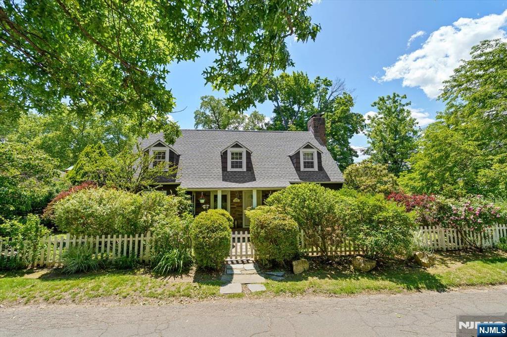Nestled in the historic Warner district of Teaneck, beautifully renovated Dutch Colonial. Situated on expansive property. Home showcases pride of ownership throughout & offers inviting open-concept layout w/1st floor bedroom -perfect for one-floor living! 1st floor boasts spacious living room, cozy stone Fireplace, Dining & stunning Eat-in kitchen complete w/ custom cabinetry, granite, ss & multiple workspaces. Generous 1st floor bedroom & full bath makes this the ideal setup for 1st floor living or guest accommodations. 2nd floor offers a spacious primary king-size bedroom suite, stone fireplace, hardwood floors & abundant closets. Additional second-floor bedroom. Rich hardwood flooring throughout. Full Basement ready to be finished or use for extra storage! Outside- an entertainerâ€™s oasis featuring paver patios, lush flowering gardens & fully fenced-in yard offering both beauty & privacy. Detached garage adds additional convenience. Expansion opportunities too! Perfectly located for NYC commuters, moments from shopping, major highways, Fairleigh Dickinson University & Houses of Worship. Welcome Home!