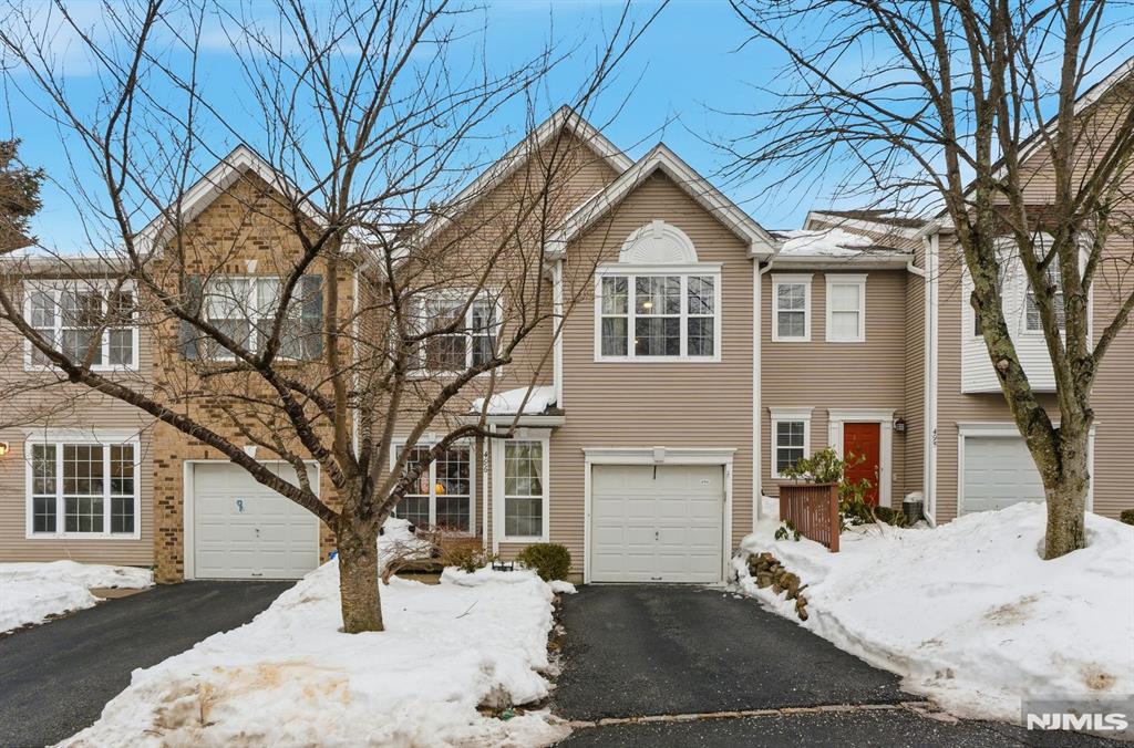 Welcome to 496 Shadow Mountain Rd, nestled in the highly sought-after Ramapo Ridge community in Mahwah. This beautifully maintained townhome offers the perfect blend of space, comfort, and lifestyle living surrounded by nature. Featuring a bright & open floor plan, the home is filled with natural light, soaring ceilings, and hardwood floors that create a warm and inviting atmosphere throughout. The spacious living room flows seamlessly into the dining area, making it ideal for entertaining or everyday living. The kitchen offers ample cabinetry, generous counter space, and a functional layout that opens to the main living areas, including your double-height family room w/ gas fireplace. Sliding doors lead to a large private deck. Upstairs, the primary suite provides a peaceful retreat with ample closet space and an en-suite bath. Additional bedrooms are well-proportioned and offer ample closet space. A finished lower level offers even more flexibility â€” perfect for a family room, gym, or recreation space â€” along with additional storage and a kitchenette. Ramapo Ridge residents enjoy resort-style amenities including a pool, clubhouse, fitness center, tennis courts, and scenic walking paths. Conveniently located near shopping, dining, major highways, and NYC transportation, this home offers low-maintenance living in one of Mahwahâ€™s most desirable communities.
