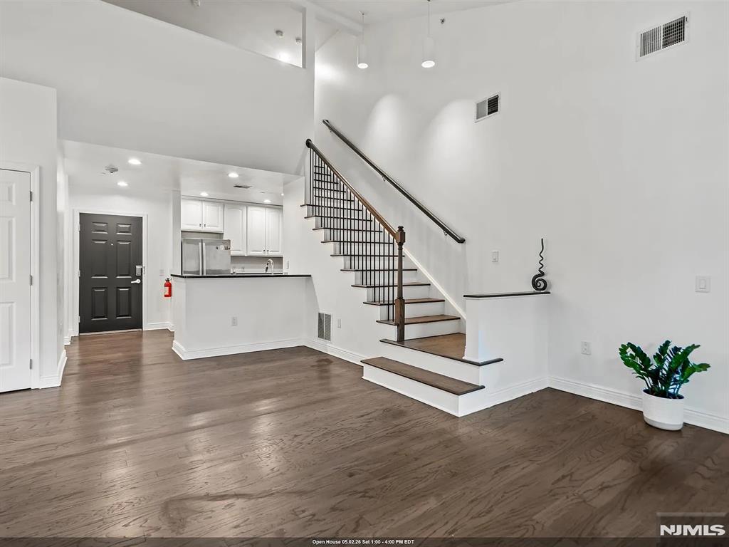 Welcome home to this top floor 3 bed 3 bath duplex premier waterfront building located at Hudson Pointe. This duplex home stretches across approx. 1383 sqft. The gourmet kitchen includes beautiful cabinetry, stainless steel appliances & granite countertops which overlooks the living room featuring a balcony. The master suite has an expansive walk-in closet & modern master bath. The second bedroom is very spacious with big windows, the top floor has a 3rd room that allows for flexible living options where it can be used as an office or a 3rd bedroom. The amenities include a 24hr doorman, fitness center, business center, cinema room & a pool. Enjoy the convenience of two car indoor parking(1 assigned & 1 floating) which is very rare! Easy access to NYC with NJ Transit and Ferry Shuttle bus located right across the street, you don't want to miss this one!