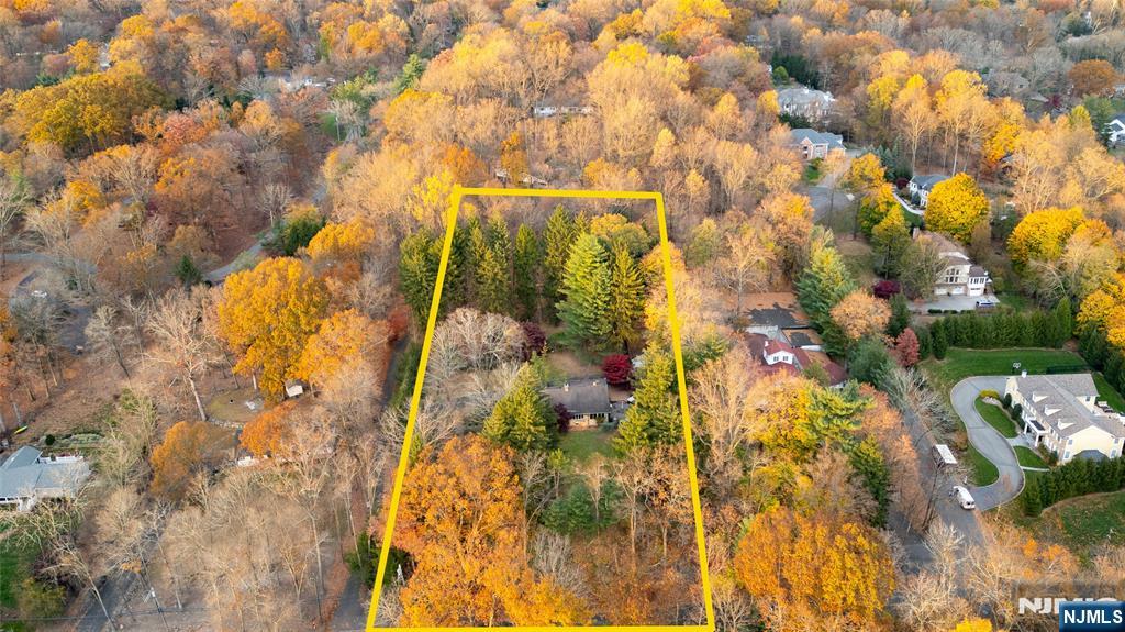 Set on one of Upper Saddle Riverâ€™s most desirable streets, this expansive 2.47-acre estate parcel presents an extraordinary opportunity to create your own private retreat. Perfectly positioned on a gentle rise, the property offers a sense of privacy and tranquility while remaining close to the heart of town, schools, local parks, and shopping. The existing sprawling ranch residence features 2/3 bedrooms, 2 full and 2 half baths, a finished basement, and expansive decking with an outdoor kitchen, jacuzzi. Ideal for entertaining or enjoying peaceful evenings overlooking the expansive grounds. The property features an impressive detached garageâ€”measuring approximately 42 feet long by 20 feet wide, with space for up to six vehicles and ample room for a workshop or studio. Whether you choose to renovate and expand the current home or build a new custom estate, the possibilities are endless. The level lot and estate-like setting make this property a rare find in Upper Saddle River.
