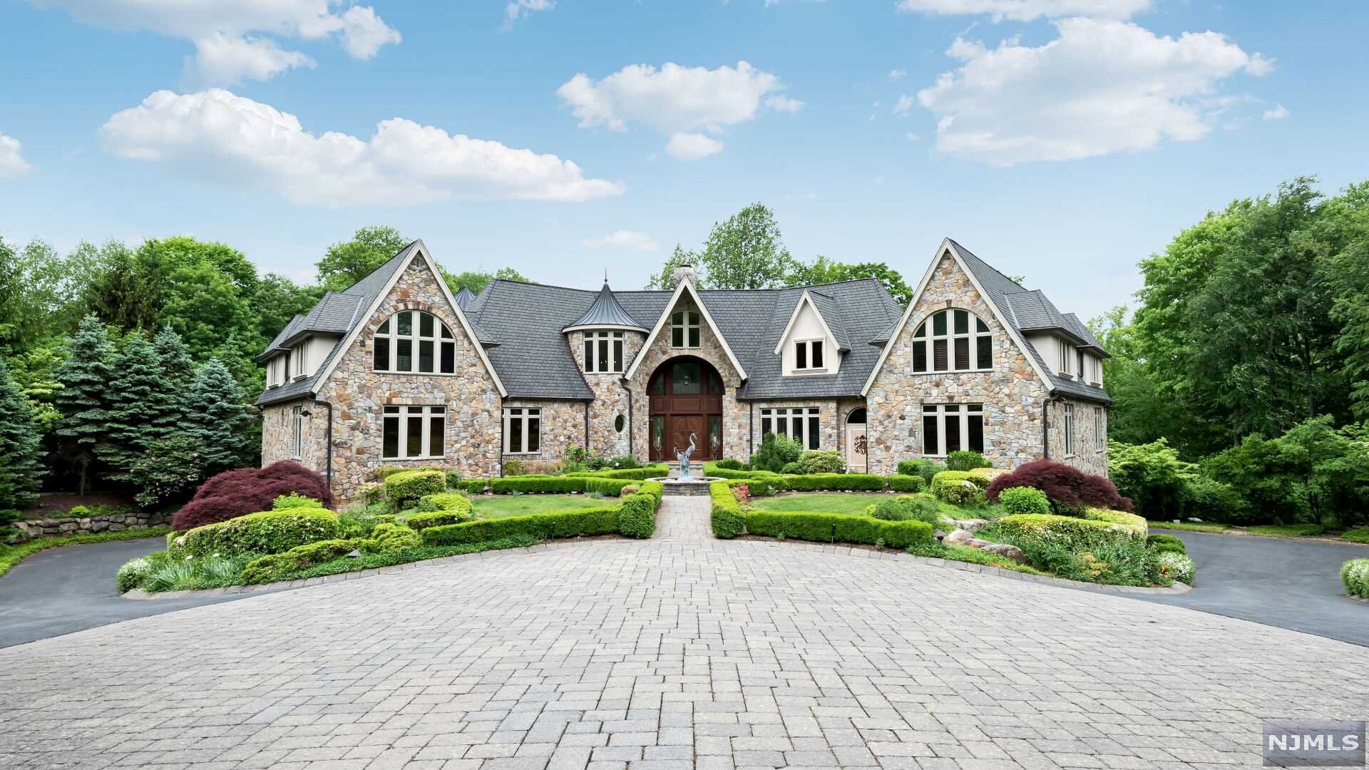 Welcome to this incredible approx. 15,000 sq. ft gated estate with 6 bedrooms, 8 full and 3 half baths situated on nearly 4 acres of meticulously manicured, private land. Enter through the foyer to find an amazing 2-story great room with fireplace, bay window, wet bar and wine cellar as well as a large formal dining room that is perfect for entertaining. The modern eat-in kitchen is complete with pantry, breakfast area and easy access to both the family room and solarium. The master bedroom suite with its own living room, large walk-in closet, private office and luxurious master bath completes the first level. The second level features 4 bedroom suites, family room with terrace, a library and an additional full bath. The full, finished lower level is truly a must see with an indoor heated pool with hot tub, spa with massage room, beauty salon, game and media rooms as well as a home gym. This fantastic estate also features 4 fireplaces, full house generator, heated driveway & more.