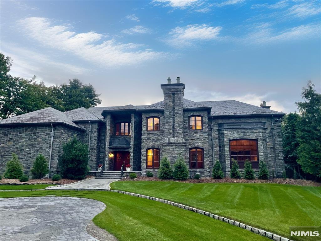MAHOGANY MANSION! SEE VIDEO! INDOOR POOL, HIGHEST QUALITY CONSTRUCTION, HAND CUT STONE EXTERIOR & ENTRY WALLS & STANCHIONS. TRUE SLATE ROOF W/COPPER & LEAD GUTTERS, ZELUCK WINDOWS & MASSIVE IRON RAILINGS. 2 STORY MAHOGANY & MARBLE ENTRY FOYER W/ SWEEPING STAIRCASE AND COFFERED CEILINGS. INCREDIBLE GREAT RM W/ 25' CEILINGS AND STONE FPL. GOURMET CHEF'S KITCHEN, CHERRY CABINETS, MARBLE COUNTERTOPS AND STONE FPL. FDR W/ 12.5' CEILINGS, RECESSED COVE LIGHTING, AND STONE FIREPLACE. GYM W/ FULL BATH, INDOOR POOL AND SPA, OFFICE, LAUNDRY. 4 CAR ACCESSORIZED GARAGE, 16' CEILINGS, UTILITY BTHRM & HEATED. MASTER SUITE W/ SITTING RM, MARBLE FPL, INLAID MAHOGANY FLOORS, SPIRAL STAIR TO KITCHEN. 3 ADDITIONAL LG EN SUITE BRs W/ OUTFITTED CEDAR WICs.