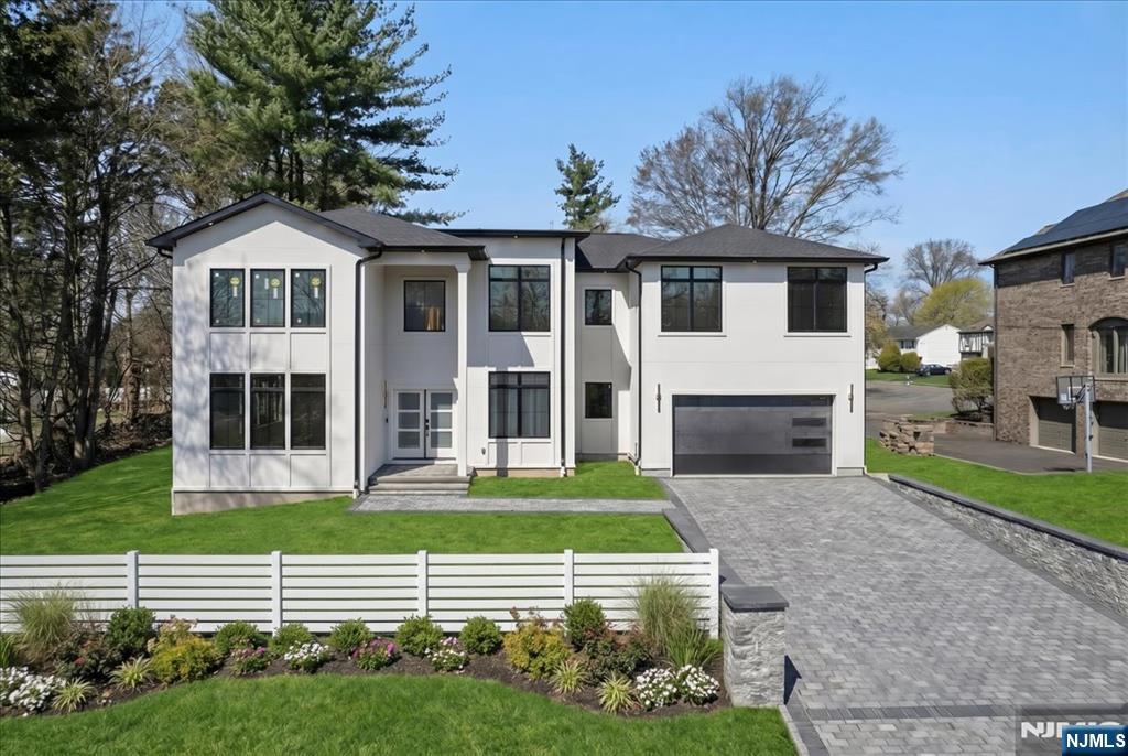 Welcome to River Edge where modern design meets every day comfort in this stunning new construction. This approximate 5,200 square foot home offers 5 bedrooms and 6.5 bathrooms. Thoughtfully designed with both elegance and functionality in mind. A grand entry foyer greets you and sets the tone leading to expansive livings spaces, soaring ceilings, and oversized windows allowing abundant national light throughout the home. The heart of the home is a chef-inspired kitchen featuring high-end appliances, custom cabinetry, center island, wine bar, and seamless flow into the dining area and family room perfect for entertaining. First floor includes a provide office ideal for the work from home setup. The luxurious primary suite boasts a spa-like bathroom and generous walk-in closet. Additional highlights include a finished lower level, premium finishes throughout and meticulous craftsmanship in every detail. The home offers the perfect balance of suburban tranquility and convenience. Close proximity to parks, top-rated schools, shopping, and New York transportation. Don't miss this opportunity! Agent/Broker Information