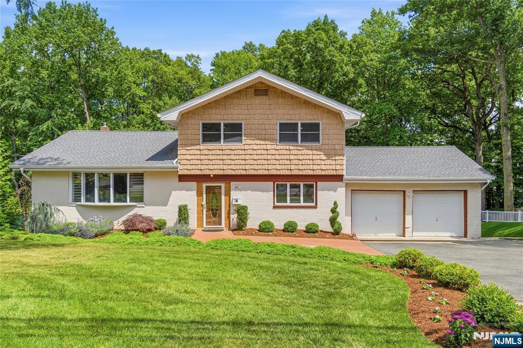 Welcome to the prestigious North Cliffs section of Englewood Cliffs, where luxury, comfort, and convenience are blended in this beautifully renovated 4-bedroom, 4-bathroom home. Situated on a generous 9,270-square-foot lot and offering approximately 2,403 square feet of living space, this residence has been thoughtfully updated to provide exceptional quality and modern living.   From the moment you step inside, youâ€™ll be impressed by the expansive living spaces, abundant natural light, and high-end finishes throughout.   This home showcases premium Viking appliances, imported Italian tile, and beautiful Mirage hardwood floors. Relax in the stunning den, highlighted by skylights and brand-new Pella windows and doors that flood the space with natural light.   Major improvements provide peace of mind, including a new roof, 3 zone furnace,  hot water heater, replaced sheetrock walls with added insulation, and a brand-new sprinkler system. Enjoy seamless indoor-outdoor living with two decks, including a newly constructed deck and patio. Photos of finished basement photos not posted.   Home to be sold as-is.