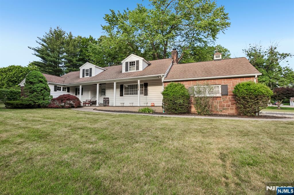 Nestled in one of Woodcliff Lake's most coveted and serene neighborhoods, this Colonial presents a rare opportunity to own a 233 X 173 flat parcel of Bergen County prime real estate overlooking a private lake. The home features 4 bedrooms, with the possibility of a 5th, 2.5 baths, a living room with fireplace, large country kitchen with SGD opening to the patio and yard, formal dining room a basement with bilco doors and a 2-car attached garage. The house has endless possibilities, add a level or extend out or just update as you see fit!. Enjoy the convenience of being near transportation, shopping, schools, parks, town pool and houses of worship. Amenities include CAC, first floor hardwood & a 2 car garage