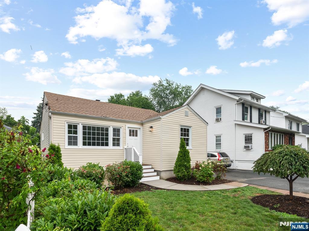 Welcome to this fully renovated, turn-key 3-bedroom, 1.5-bathroom ranch home in the heart of Clifton, NJ. The sunlit main floor features a spacious living room, three comfortable bedrooms, a brand-new pristine full bathroom, and a gorgeous new kitchen. Gleaming new hardwood floors and modern lighting flow seamlessly throughout the entire level. Just off the kitchen, a cozy covered porch leads to a private backyard oasis complete with mature landscaping, a beautiful paver patio, and a handy storage shed. The fully finished walk-out basement offers incredible bonus living space with all-new flooring, updated lighting, and a convenient half bath. Enjoy ultimate peace of mind with a brand-new roof, completely new electrical wiring, hot water baseboard heating, and central air conditioning. Ideally located for an easy commute, this immaculate home is just minutes away from public transportation, local schools, houses of worship, and premium shopping. Seller is licensed realtor.