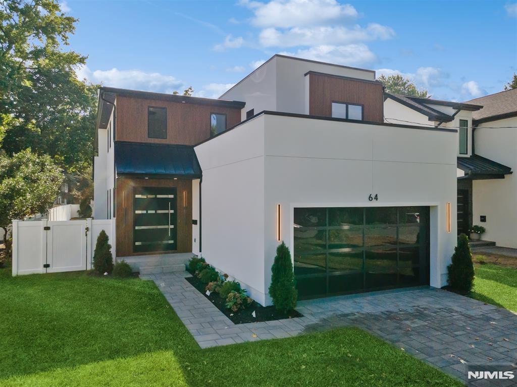 >>Lsiting agent Anat 201.341.4765<< Opulent living in this ONE-YEAR-YOUNG modern home, spanning 5800 SF with an open floor plan. This home has 6 BR and 6 FBTH, featuring radiant heated floors in the 1st and 2nd floor baths. The exterior showcases a blend of sleek stucco and modern cladding. The 1st FLR has an 18' high foyer, an open space plan & 10' long. A gourmet kitchen with top appliances, including a huge island. Large sliders lead to the patio and expansive backyard that can accommodate a pool(pool not included). The 2nd floor offers a master suite complete w/high vaulted ceilings, his/her WIC & a spa-like master bath: 3 additional ensuite BRs, all w/high ceilings, large windows & closets. Laundry rm is on the 2nd flr as well. The lower floor features a rec RM,BR, FBTH, gym, and a home theater. Additional features include a generator, electric car charger, torsion-type garage door, and central vac. The BKYD features a large tile patio.