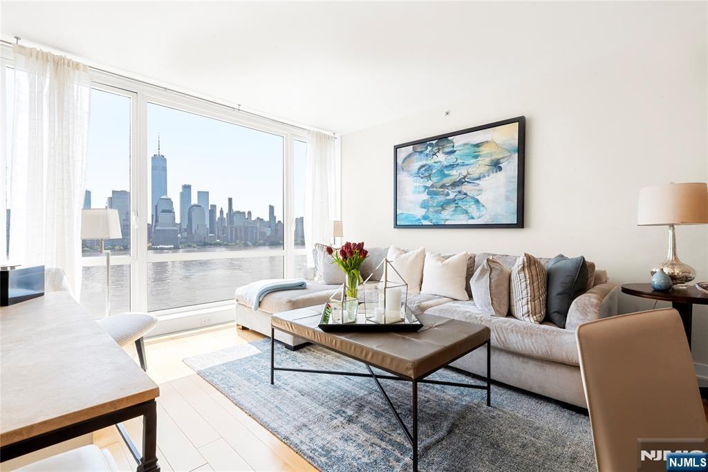 Welcome to Residence 1704 at Crystal Point, an exceptional 1 bedroom, 1.5 bath condominium offering approximately 1,050 sq.ft. of luxury living in Downtown Jersey City. Perched above the Hudson River, this stunning home features sweeping direct views of the New York City skyline & Hudson River from every room, creating a striking backdrop day & night.Designed for comfort and style, the spacious layout is filled with natural light through oversized windows framing panoramic Hudson River waterfront views. The open concept living & dining area is ideal for entertaining. The bedroom suite serves as a private retreat with an en-suite bath and generous closet space, while a powder room adds convenience. Valet garage parking for one car is included.Residents of Crystal Point enjoy resort style amenities including a 24 hour concierge, outdoor swimming pool, fitness center, yoga room, resident lounge, childrenâ€™s playroom, screening room, billiards room, & beautifully landscaped outdoor spaces overlooking Manhattan.Ideally located along the waterfront, the building offers quick access to Exchange Place & Grove Street PATH stations, NY Waterway Ferry service, and Light Rail for an easy commute into Manhattan.Just moments away, enjoy premier dining, nightlife, the waterfront promenade, boutique shopping, cafés, and everyday conveniences. Crystal Point delivers the perfect blend of luxury, lifestyle, and unbeatable location.