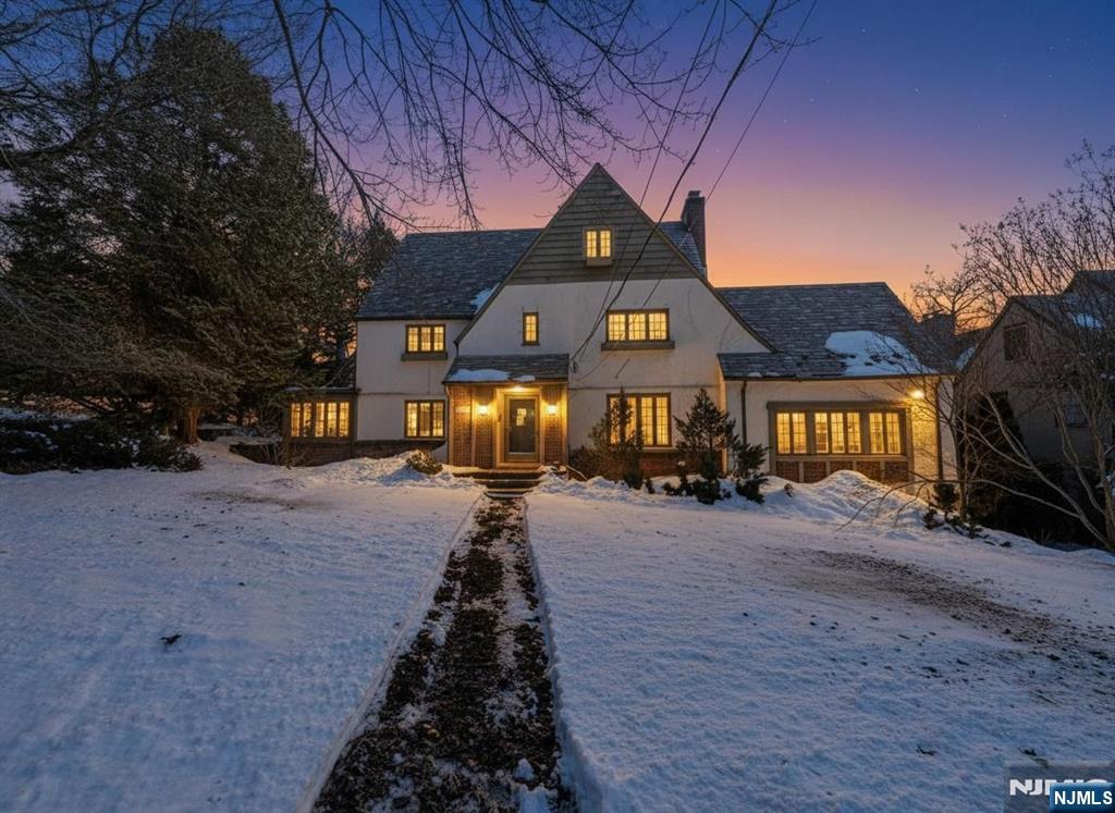 Welcome to this spacious Tudor-style Colonial located in the desirable borough of Glen Rock. Situated on an approximately 0.39-acre corner lot, this classic home offers over 3,500 square feet of living space and timeless architectural charm. The property features 6 bedrooms, multiple bathrooms, and generous living areas designed for comfortable everyday living and entertaining. Built in 1923, the home offers a traditional layout with large rooms, hardwood flooring, and plenty of natural light throughout. Additional highlights include a finished basement with ground-level access, fireplace, attached garage, and a deck/patio overlooking the property. Conveniently located near local parks, schools, shopping, and transportation options, this property offers a great opportunity to own a classic home in one of Bergen Countyâ€™s most sought-after communities. With its spacious layout and prime location, this home presents endless potential for customization and modernization.