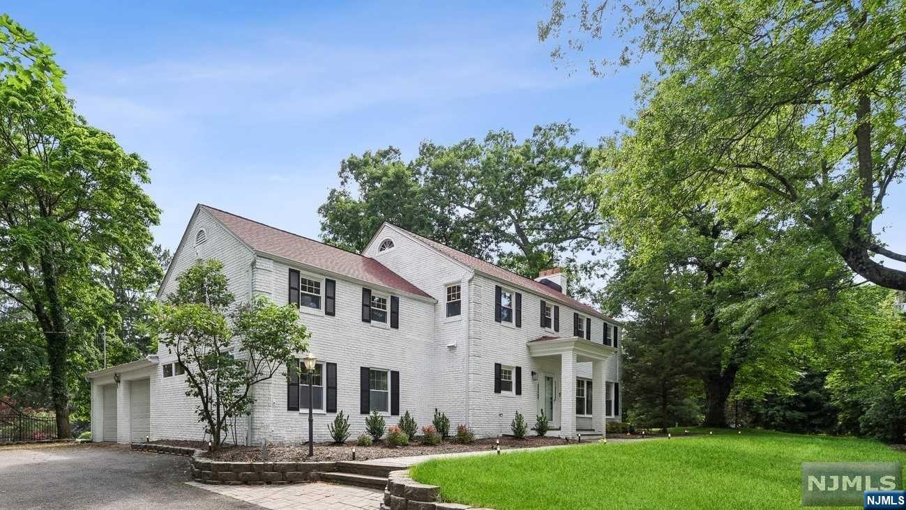 Step into luxury living with this custom Colonial masterpiece nestled between picturesque South Mountain Reservation and Fox Hill Reserve. Stunning property sits on .37-acre lot with paver walkway to front covered porch. Meticulously renovated interior with most updates completed in 2018. New Maple prefinished hardwood floors throughout 1st floor + double-height staircase entryway. Open floor plan living room and family room with large windows offer views of front lawn and backyard with sliding door to paver patio and private, landscaped grounds. Eat-in kitchen with granite counters and Viking appliances flows to dining room. 1st floor ensuite with office area. Oversized 2-car garage. Upstairs, loft/lounge + washer/dryer areas; primary suite with gas fireplace + spa-like bathroom; junior suite; bedroom; hall bath. Unfinished basement with potential for addi living space. Located just minutes from Deerfield Elementary, Mall + Millburn and Short Hills Midtown Direct.