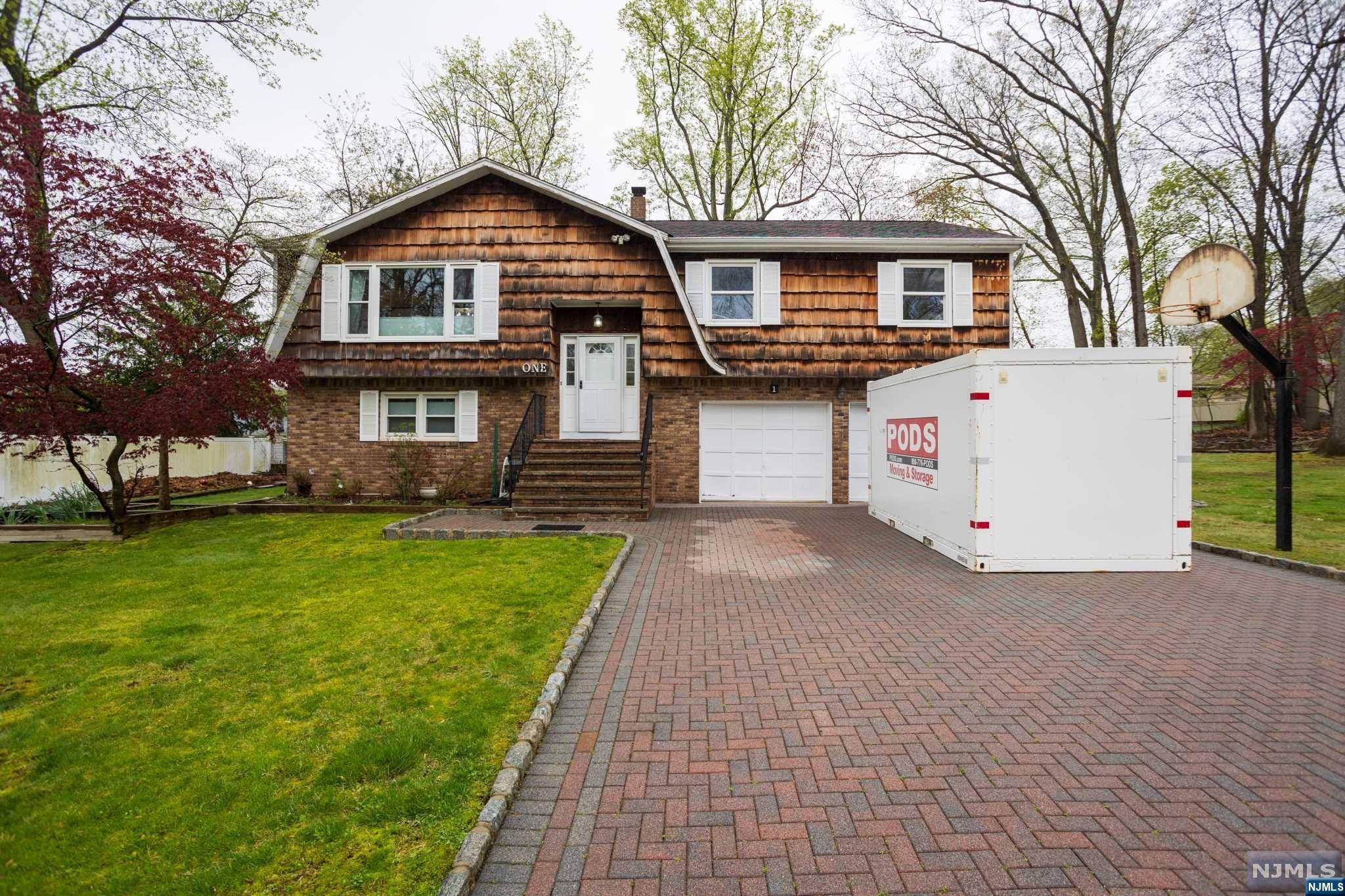 Welcome home to this beautiful bi-level build in 1977, located on a quiet cul de sac. This open floor concept is ideal for everyday living w/spacious living room, dining room, and modern tiled kitchen.20x24 Deck off Kitchen w/similar size concrete patio under deck. The large master bedroom has a walk-in closet and direct access to the full bathroom plus offers separate space for a full bath and two additional bedrooms. The lower level offers a spacious family room Additional bedroom is ideal for office/guest room space another full bath and tons of closets are an added feature. Sliding glass doors lead to a spacious backyard An oversized 2 car garage adds additional room for storage. Other amenities include central air and underground sprinkler system full attic fan w/speed control fully floored walkable attic w/easy access from hallway sep Nest smart therm for heat/cool half acre zone. Close to NYC trans,schools,shops & walking dist. to community pool. Must see