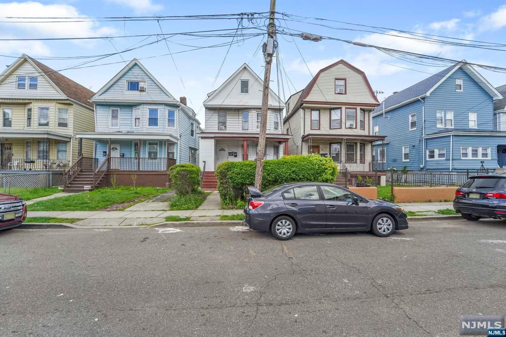 Welcome to a great incoming producing multi family home in Orange, NJ. This charming home features a total of 8 bedrooms and 3 bathrooms, making it the perfect choice for owner occupied or for investors looking for a profitable rental property. Each unit boasts ample living space, plenty of natural light, and nice floors throughout. The first floor unit features a spacious living room, a formal dining room, a cozy kitchen with stainless steel appliances, and two generous bedrooms. The second floor unit mirrors the first floor with an additional third bedroom. But the highlight of this property is the fully finished attic, which provides extra living space with 2 bedrooms and a full bathroom.