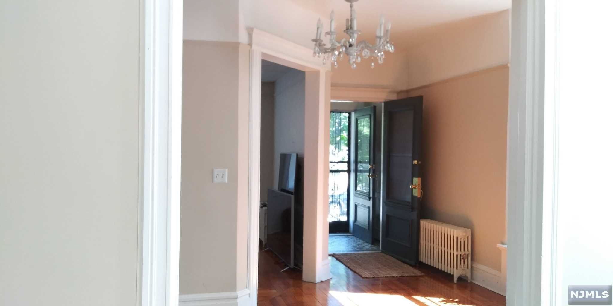 Buy! Clean, Contemporary Brick Beauty with certified artistic swank. This chic living space is appealing on all levels. The 1st floor showcases tasteful and elegant moldings, beautiful faux fireplaces LR & formal DR; cozy HB, EIK w/ mud room exit to back yard, laundry at back-stair. 2nd fl has FB w/ touch panel vanity, tiled walls + floors for hygiene-conscious! 3 spacious bedrooms to sleep, play, entertain. Basement is the best yet! Food prep area, 2nd laundry, game room, 2nd FB & 4th bedroom. Closets, Storage all levels. Backyard = patio, plant garden + play area. Great for entertainment + happy gatherings. Don't miss this SMART OPPORTUNITY to close on this home! Blocks from Rt 280, GS Pkwy. Walk to light-rail, Near Newark Penn, Science Park, Payne Tech, NJIT, RU, ECC, downtown, parks, recreation, shopping.