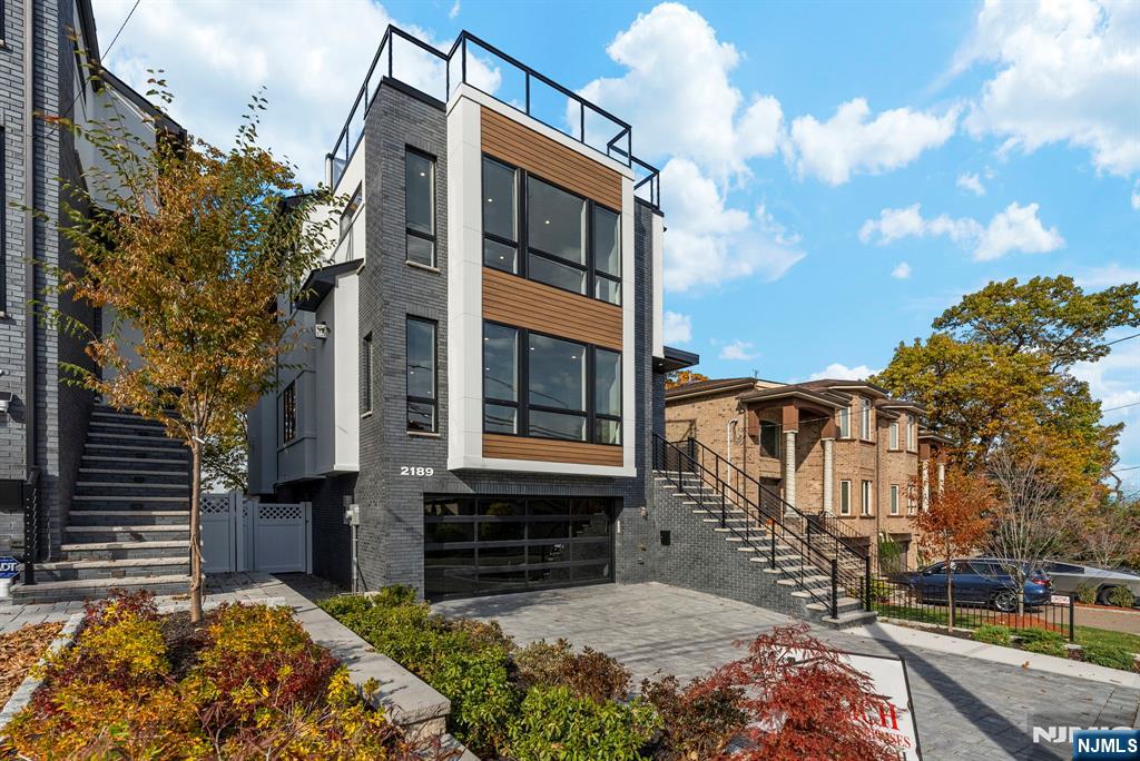Newly constructed four-level residence offering 4,200 square feet of meticulously planned living space, with three bedrooms, a private den, four full baths, and two half baths. The main floor showcases an expansive open-concept layout highlighted by a sunken family room that flows effortlessly to the outdoors through eight-foot sliding glass doors opening to a walk-out terrace. The chefâ€™s kitchen is outfitted with premium Thermador appliances, an oversized island perfect for both entertaining and everyday use, and a striking full-wall wet bar. Seven-inch wide European white oak prefinished engineered flooring runs throughout, adding warmth and refined elegance. Each bedroom is designed as a serene retreat with a spacious walk-in closet and a dedicated ensuite bathroom for maximum privacy and comfort. The versatile den can easily serve as a home office, media lounge, or guest space. The rooftop level is an entertainerâ€™s dream, featuring a generous terrace with floating pedestal pavers, a wet bar, and a powder roomâ€”ideal for hosting or unwinding in style. Thoughtfully designed across all four levels, this new-construction home seamlessly combines modern architecture, upscale finishes, and highly functional living spaces, delivering a sophisticated lifestyle for those who value contemporary luxury.