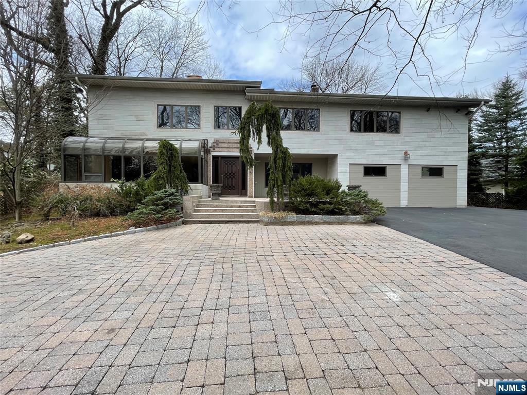 NEWLY RENOVATED CUSTOM SIX BR, SIX FULL AND TWO HALF BATHS CONTEMPORARY HOME ON .46 ACRES IN ENGLEWOODS PRESTIGIOUS EAST HILL NEIGHBORHOOD.FIRST FLOOR FEATURES GRAND FOYER,DEN/LIBRARY,FDR,LR W/SLIDERS OUT TO THE BACKYARD,HALF BATH,GOURMET KOSHAR EAT IN KITCHEN W/STAINLESS STEEL APPLIANCES,LARGE WALKIN PANTRY AND SLIDERS TO THE BACKYARD;IN ADDITION THERE IS A GUEST SUITE W/SITTING AREA,FULL BATH AND BEDROOM.EXQUISITE WINDING STAIRCASE LEADS TO THE SECOND FLOOR W/PRIMARY BEDROOM AND BATH + 4 ADDITIONAL BEDROOMS EACH WITH ITS OWN BATH. LOWER LEVEL FEATURES A LARGE REC ROOM, A STORAGE CLOSET AND STORAGE ROOM,EXERCISE ROOM,LAUNDRY ROOM AND FULL BATH.HOME HAS A FULL GENERATOR.CLOSE TO SHOPPING,HOUSES OF WORSHIP, PUBLIC TRANSPORTATION AND MINUTES TO NEW YORK CITY. A MUST SEE-IT WONT LAST!!!!!