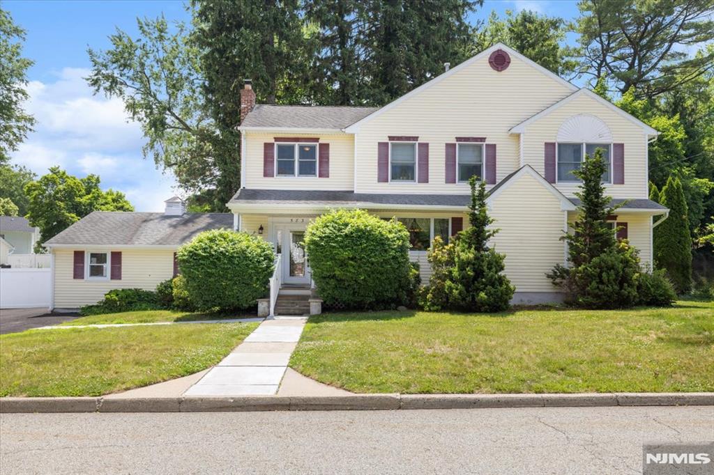 Beautifully renovated 5-bedroom, 3 full bath Colonial offering the perfect blend of comfort, style, and efficiency. The spacious primary suite features a relaxing whirlpool spa, creating a private retreat. Hardwood floors flow throughout the home, while the updated kitchen boasts stainless steel appliances, granite countertops, and custom cherry cabinetry. Designed for everyday living and entertaining, the open floor plan includes a welcoming living room with a wood-burning fireplace and easy access to the slate patio and yard. A first-floor bedroom and full bath provide excellent flexibility for guests, extended family, or a home office. Additional features include Andersen windows, dual-zone HVAC systems, enhanced insulation, and updated electrical service. The partially finished basement offers space for a recreation room, office, or game room, along with a separate utility and laundry area. Top-notch schools, conveniently located by all major highways, shopping, dining, and NYC transportation via train and bus.