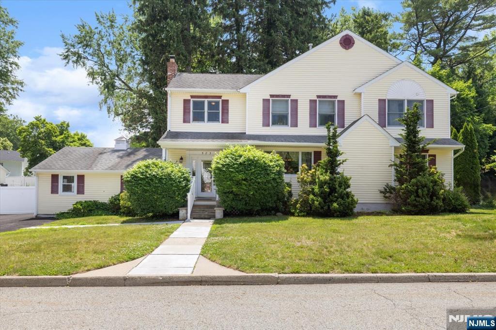 Beautifully renovated 5-bedroom, 3 full bath Colonial offering the perfect blend of comfort, style, and efficiency. The spacious primary suite features a relaxing whirlpool spa, creating a private retreat. Hardwood floors flow throughout the home, while the updated kitchen boasts stainless steel appliances, granite countertops, and custom cherry cabinetry. Designed for everyday living and entertaining, the open floor plan includes a welcoming living room with a wood-burning fireplace and easy access to the slate patio and yard. A first-floor bedroom and full bath provide excellent flexibility for guests, extended family, or a home office. Additional features include Andersen windows, dual-zone HVAC systems, enhanced insulation, and updated electrical service. The partially finished basement offers space for a recreation room, office, or game room, along with a separate utility and laundry area. Top-notch schools, conveniently located by all major highways, shopping, dining, and NYC transportation via train and bus.