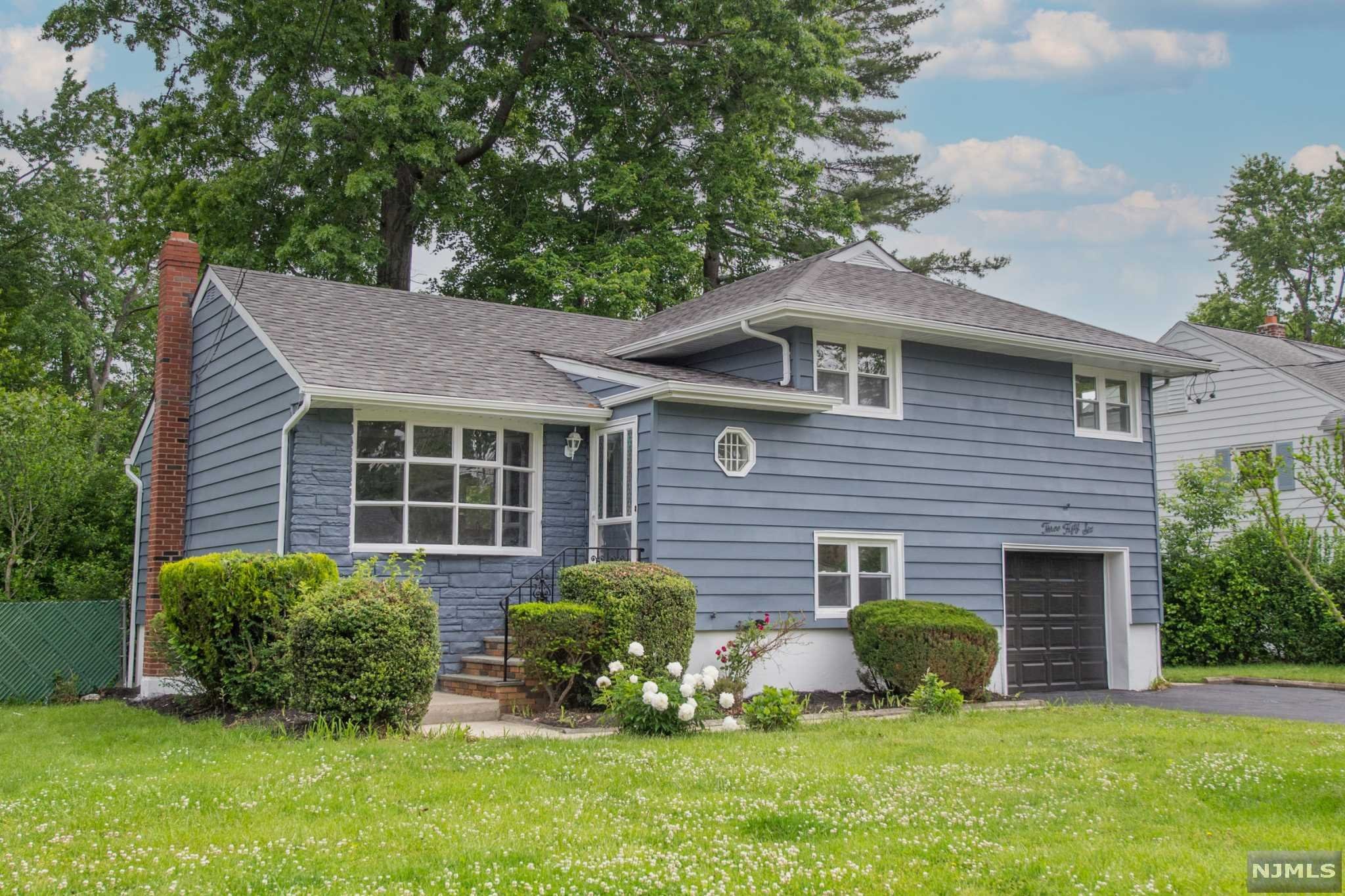 Welcome home to this fully renovated beauty in a quiet and private location in New Milford. Oversized driveway large enough for multiple cars. The 1st floor features a brand new kitchen, dining, living room. Second floor has 3 bedrooms and a new full bathroom. The ground level has a family room, new half bath and laundry hookup. Other features are new windows, new appliances, new AC system, new finished hardwood floors. Basement is also finished w plenty of room to entertain! Close proximity to NYC bus and train, schools and shopping! You don't want to miss this one.