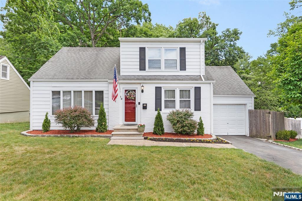 Welcome to 19 Glenview Drive, a charming Cape Cod located on a quiet dead-end street in the highly sought-after St. Cloud section of West Orange, bordering Livingston. This move-in-ready home offers the perfect combination of comfort, convenience, and outdoor living. The private, fully fenced backyard is an entertainer's dream, spacious patio, and expansive decks ideal for summer gatherings and relaxing evenings. Inside, hardwood floors flow throughout the main level, while the updated eat-in kitchen boasts Quartz countertops and stainless steel KitchenAid appliances. The flexible floor plan includes a convenient first-floor bedroom and two generously sized upstairs bedrooms. The home is equipped with forced hot air heating and central air conditioning, providing year-round comfort. Plumbing is already in place for a potential second bathroom on the upper level. The finished walkout basement provides additional living space, direct backyard access, and abundant storage with an extensive crawl space. Ideally situated near South Mountain Reservation, outdoor enthusiasts will enjoy easy access to hiking, biking, and nature trails. Commuters will appreciate the short walk to NYC bus transportation, and school bus pickup is conveniently located across the street. Enjoy the peaceful setting of a quiet neighborhood while remaining close to shopping, dining, parks, major highways, and everything West Orange has to offer.