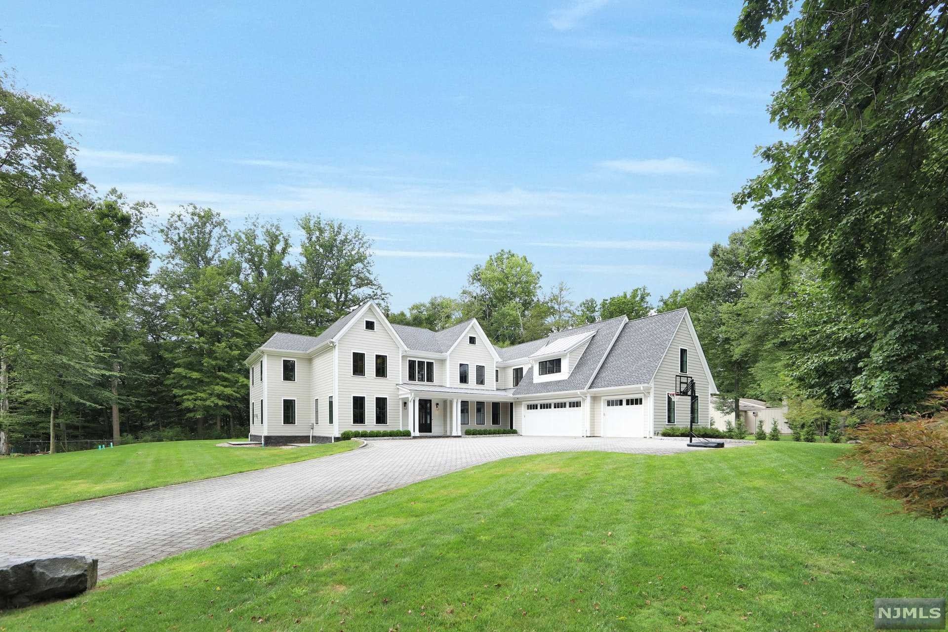 PERFECTION PERSONIFIED. CUSTOM HOME BUILT ON ONE ACRE OVERLOOKING LAKE TAPPAN. AMAZING ATTENTION TO DETAIL W/ HIGH-LEVEL FINISHES THROUGHOUT. DESIRED OPEN FLOOR PLAN CONCEPT (SMART HOME ENABLED) APPROX. 6,100 SQ FT. OF LIVING SPACE WITH 5 O/S BEDROOMS, 5 FULL BATHS, AND ONE POWDER ROOM. RADIANT HEAT ON ALL LEVELS (INCLUDING LL & GARAGE), HIGH CEILINGS (9FT), GRANDIOSE CHEF'S KITCHEN WITH DOUBLE ISLAND, PREP/BREAKFAST BAR, WINE REF, MIELE STEAMER, AND SUB-ZERO REF. NATURAL YELLOW BEAMS OF LIGHT STREAMING IN FROM WALL TO WALL WINDOWS. DOORS OFF KITCHEN AND PATIO LEAD TO FULL-LENGTH BLUE STONE PATIO AND COVERED PORCH. EVEN THE LAUNDRY ROOM IS AMAZING!! BONUS: CUSTOM OUTDOOR STONE FIREPLACE AND TV! SECOND FLOOR HAS THREE JR. SUITES AS WELL AS AN IMPRESSIVE PRIME BEDROOM WITH SOARING TRAY CEILINGS, CUSTOM WALK IN CLOSETS, AND A LUXURIOUS BATH EQUIPPED WITH SOAKING TUB & STEAM SHOWER. CLOSE TO NYC TRANSPORTATION, PARKS, AND BLUE-RIBBON SCHOOLS. CALL TODAY TO TOUR!