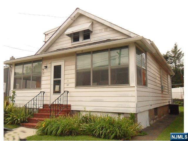 Cute as a button, ready for your finishing touches. Great opportunity for first time home buyers and investors. Sunny front porch opens to a livin groom/ sitting area, which could alternatively be used as a dining room. Large bedroom with walk-in closet, full bath and a modest eat-in kitchen complete the first level. The second level could easily be 2 separate bedrooms and has a half bath. Plenty of storage, hardwood floors and central air. High and dry basement with possibilities for finishing. This home has been well cared for and sits on a nice-sized lot with backyard and a detached garage. Sizeable driveway provides plenty of parking. Located in the desirable and well located town of Totowa, one of the fastest-growing suburbs in New Jersey. Easy access to NYC via multiple major highways and bus. This is an as-is sale.