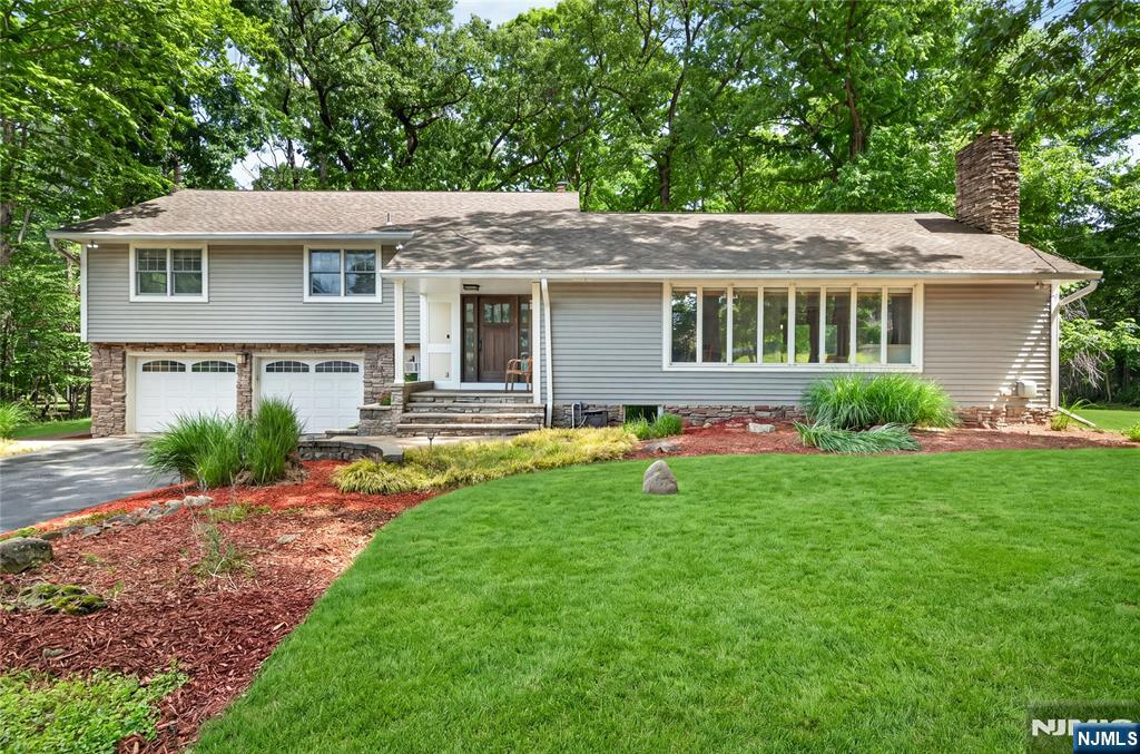 Set in one of Upper Saddle Riverâ€™s most sought after neighborhoods, this special 4 bedroom 3 full bathroom contemporary split level home offers timeless design & modern comfort throughout. A gracious entry foyer welcomes you to an expansive living room w/a stone gas fireplace & formal dining room. The chefâ€™s kitchen features stainless steel appliances, induction cooktop, Cambria quartz countertops, wine fridge & center island w/an open flow to the family room. A double set of French doors take you to a large deck plus a paver patio, overlooking an incredible flat private backyard, the ideal setting for outdoor dining, gatherings & play. The upper level boasts a primary suite, w/a walk-in closet & lux primary bathrm. 3 additional generously sized bedrooms & an updated full bathroom complete the second level. The lower level features another family room space w/an updated full bathroom. Built-in desk area offers the perfect work from home space. A huge fully finished basement w/a gas fireplace offers unlimited versatility for recreation, relaxation or guest accommodations. Enjoy all that Upper Saddle River has to offer, w/top-rated schools, convenient shopping & dining nearby, easy access to highways & NYC transportation. Donâ€™t miss this MUST SEE home which also includes a one year home warranty!