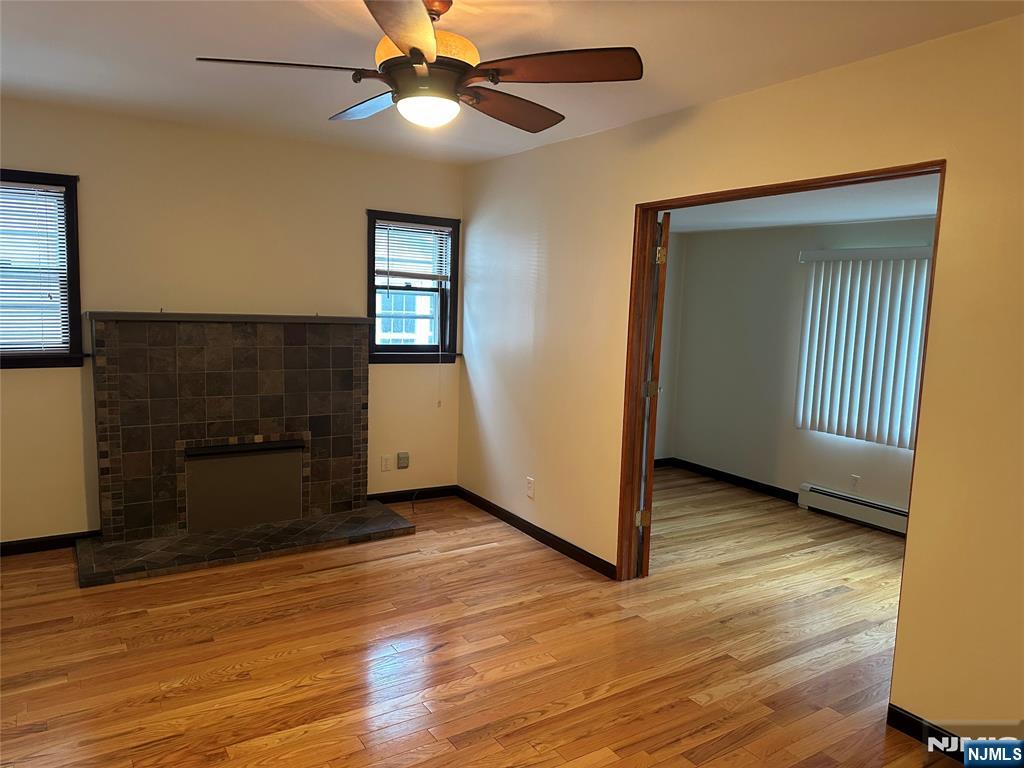 Welcome home to this incredibly maintained first floor unit in the heart of Ridgefield Park! Spread out in over 1200 square feet of living space, 2 bedrooms, 2 full baths PLUS den perfect for a home office off the living room, an eat-in-kitchen, formal dining room, AND a full basement, ideal for a rec room, home gym, or anything you might need to make this house a home! The unit features hardwood floors throughout, a washer dryer in-unit, garage parking with additional spots available in the driveway, back deck and back yard access. All this is available in a premium neighborhood of Ridgefield Park - commute to Port Authority in half an hour, close to shops, parks and schools! Submit your application today!