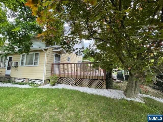 Welcome to this charming home with plenty of room for all of your needs. This 1/2 duplex is a corner unit, with a freshly painted deck. On this quiet private street, a fenced yard is across from the unit. Enter into the kitchen and then a welcoming dining room and living room are ahead. The floor plan is open. The laundry room and full bath are conveniently located on the main living level. On the 2nd floor are 2 bedrooms and the third, a large bedroom with additional space. Move in ready. Close to transportation, parks, and shopping.Townhouse alternative with back yard and no HOA fees.