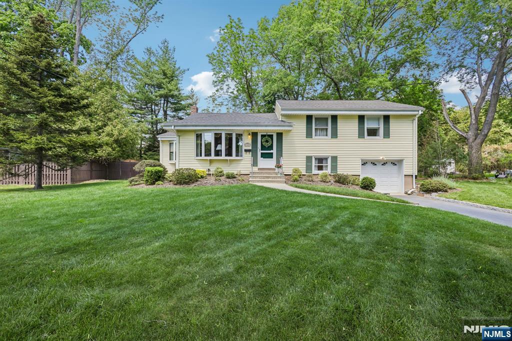 HARRINGTON PARK SAYS IT ALL!!! Nestled on a Quiet Circle in a Fantastic Neighborhood, this HOME offers a Warm and Inviting Atmosphere just one block from HIGHLAND Field and only a few blocks from One of the Areaâ€™s Top-Rated Schools. The Layout provides a Spacious and Welcoming Setting, Ideal for both Everyday Living and Entertaining. A Generous-sized Living Room flows seamlessly into the Sunlit Dining Room accented by Skylights, creating an Open and Airy Feel throughout. Additional features Include an Ample Driveway with Attached Garage, plus a Full Basement Offering Endless Possibilities for Additional Living Space, Recreation, Storage, or Versatility to Suit your Needs. The Manicured Landscaping, Spacious Yard and Walk-out Deck Area are Perfect for Hosting Gatherings, Relaxing Outdoors, or simply Unwinding in Your Own Private Retreat. Bring your Vision and Personal Touches to Make this HOME truly Your Own. Combining Suburban Tranquility with Convenient Proximity to Shopping, Parks, Amenities, and Major Commuting Routes. HOME is SOLD AS IS with NO KNOWN ISSUES. This is an Exceptional Opportunity to ENJOY all that Harrington Park has to Offer. DUE TO MULTIPLE OFFERS >SELLER is Calling Highest & Best by 12 noon Friday June 5th.