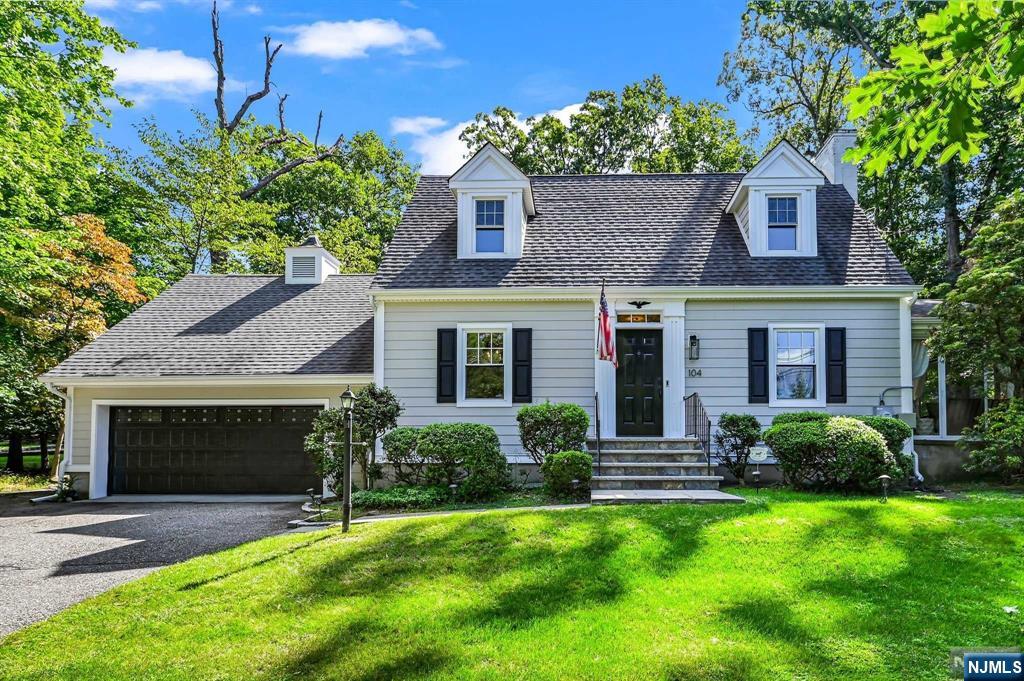 Welcome to this spacious and charming Cape Cod Colonial, set back from the road on a beautifully landscaped property. This home offers an ideal blend of comfort, privacy, and modern updates. The large Family Room overlooks a wooded backyard providing a serene and private setting. Hardwood floors add warmth, and the delightful Sunroom, accessible from the Family Room, offers a perfect space to unwind. Distinctive features include two staircases leading to separate bedroom areas, offering a versatile layout for a Master Bedroom or guest suite. Commuting to Manhattan is a breeze with nearby park-and-ride options, and you'll be part of a top-ranked public school district as rated by the NJ Department of Education.