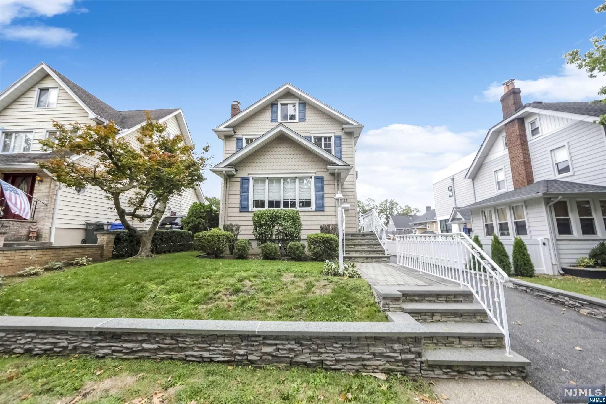 Spacious 2/3 bedroom colonial meticulously maintained on a lovely tree-lined street.The entry way is flanked by 2 columns that lead into a lrg living room w/gas fireplace,formal dining rm,eat-in kitchen w/tons of cabinets & granite counters.The spacious eating area w/a skylight opens to the family rm w/a wall of windows & door leading to the backyard.A powder rm complete the 1st level.The 2nd floor leads to an over-sized primary bedrm w/lots of closets.This room was originally 2 bedrms & can easily be converted back to make this home a 3 bedrm.Nice-sized 2nd bedrm and renovated bathrm.Walk-up attic great for storage or can be finished to expand this wonderful home.Unfinished basement w/built-in shelves for storage.So many features throughout;hardwood flrs,rececessed lighting,central air,sprinklers,beautiful outdoor stonework,vinyl siding,paver walkway,1 car garage.Close to highways,restaurants,shopping,schools & transportation.Perfect blend of suburban charm & urban accessibility!