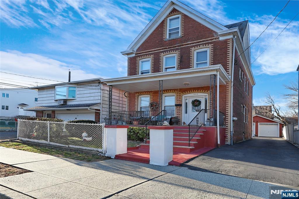Perfect opportunity for both owner-occupants and investors. Move in condition 2 family home! The first floor offers 2 bedrooms, eat-in kitchen, living room and full bathroom, mud room. Second floor two story apartment with 3 bedrooms and 2 bathrooms, living room, eat-in kitchen. Finished basement with summer kitchen, rec room and full bathroom, 2 car garage and patio. Separate meters for electrical utilities and gas. Enjoy the convenience of driveway parking and a prime location close to schools, shopping, and major transportation options, including highways, buses, and train stations. The NYC bus stop is just blocks away, with only a 25-minute commute to the city.