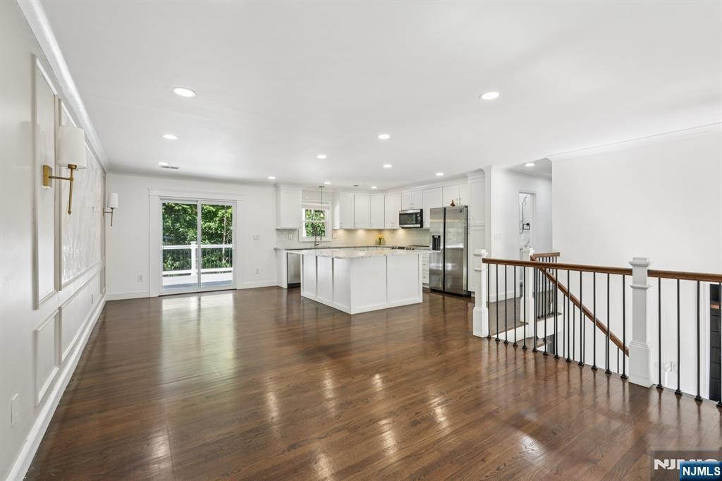Welcome to your dream home in the heart of Hopatcong! This stunning 4-bedroom, 3-bath residence blends timeless charm with modern updates. Step inside to find an open-concept layout flooded with natural light, hardwood floors throughout, a sleek, updated kitchen, brand new septic system, and spa-like bathrooms that feel straight out of the magazine.