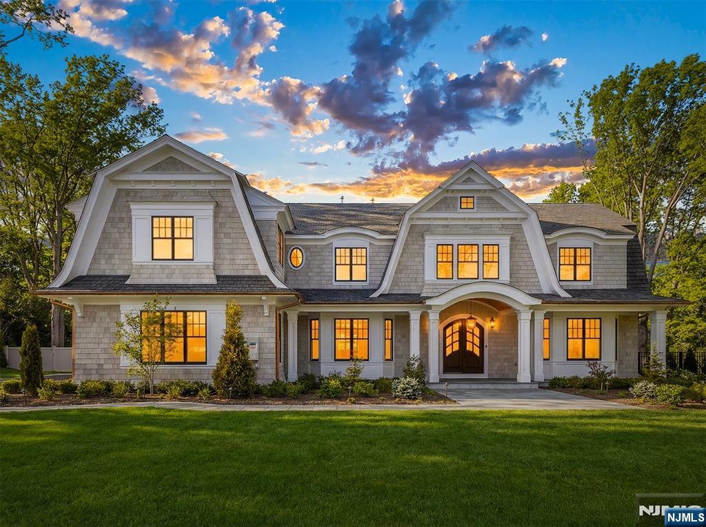 Once in a Lifetime...A Modern Marvel-newly built 6 Bedroom 7.5 Bath Ridgewood Estate that entices with a Hamptons flair. An idyllic setting on coveted Knollwood Rd in the "old country club" section. Where homes of this extraordinary caliber rarely come to market. Elevated tranquility awaits, situated on a bucolic 2-acres. Step into a world of style & luxury designed by pedigreed architect Jordan Rosenberg. Offering 8000+- sq ft of modern luxury living on 3 levels. Boasting a popular center hall floor-plan w/ grand sized rooms. An inviting 2 story EF, lavish chevron, mahogany flooring, soaring 14ft. ceilings & abundantly positioned new windows create luminous refined openness. This perfect setting embraces our Modern lifestyle. The chef's Kitchen extraordinaire, is equipped w/ designer cabinetry, high end appliances; Wolf, Thermador & Miele 72-in fridge! A 10-ft Calcutta marbled waterfall peninsula, 2 sinks & Thermador espresso bar. A custom wall of entertainment w/ warm burning fireplace is ideal for relaxing w/ seamless access to the Veranda. Where the home transforms into a private resort. Boasting 2 summer kitchens, salt-water heated Pool, Cabana +full bath; 2 Pergolas. Highlights: Primary Bedrm 2 ensuite luxury baths, espresso bar. Theater, Wine cellar; 3 car heated garage, Generac Generator! Nearby charming town, shopping, dining, Ranked in NJ's Top 5-Public School. Hassle free commute to NYC via Train. Contact Angela Cuciniello for Details 201-657-6084. Don't Miss out!