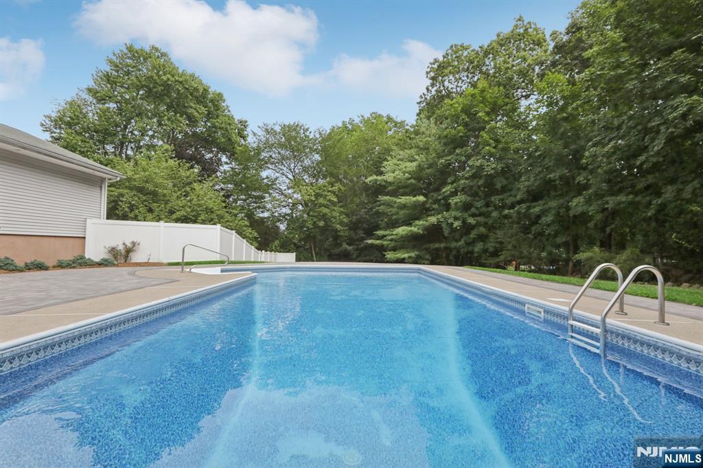 @ @ @ UNDER CONTRACT | NO LONGER AVAILABLE @ @ @ Welcome to 504 Oldwoods Road, a move-in ready gem on one of Wyckoffâ€™s most desirable & idyllic streets, known for its wide roadway, deep setbacks, and surrounded by $1-3 million-dollar homes. | Just minutes from Zabriskie Pond, Wyckoff's top-rated schools, Boulder Run shopping center in town, Rt 208/major highways, and NYC transit, this ideal location offers the perfect balance of accessibility & tranquility. | Set on over 25,000 sq ft (0.6 acres), this beautifully maintained 4-bedroom, 2.5-bath home offers rare privacy, space to expand, & resort-style living. | The huge backyard oasis is ideal for entertaining or peaceful family gatherings, centered around a glistening, exquisite, heated in-ground pool & Timbertech deck surrounded by tranquil foliage. | Inside, the eat-in kitchen has been updated with brand new quartz countertops & new (1yr) premium stainless steel appliance package, & features ample cabinetry. | Updated oversized windows flood the home with exceptional natural light & connect every room to the lush outdoor surroundings. | Additional standout upgrades include new gas boiler/AC system (all 1 yr), upgraded 200 amp service, new shed, in-ground sprinklers, & recently updated fence--ensuring comfort, efficiency, value, & peace of mind (plus NO septic!). | NYC commuters will love the convenience of a direct bus stop just one block (1-min) away.